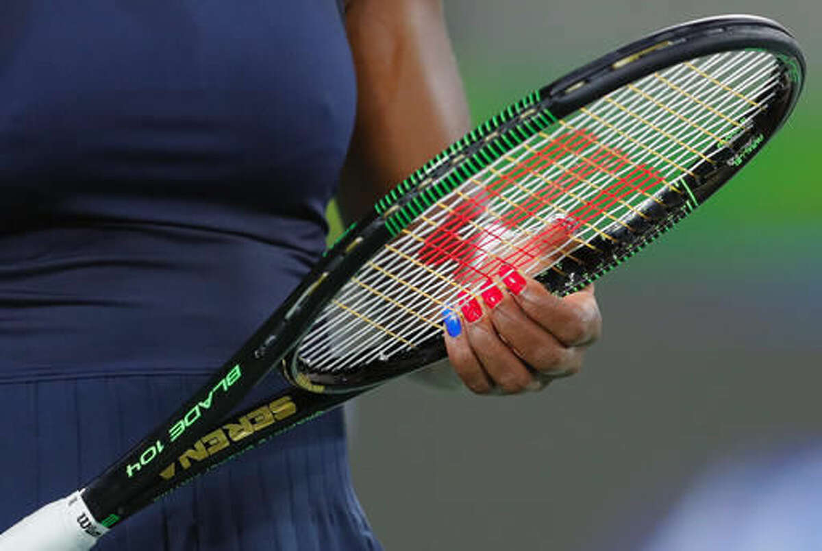 Serena Williams of the United States holds a racket during the match against France's Alize Cornet in the women's tennis competition at the 2016 Summer Olympics in Rio de Janeiro, Brazil, Monday, Aug. 8, 2016. (AP Photo/Vadim Ghirda)