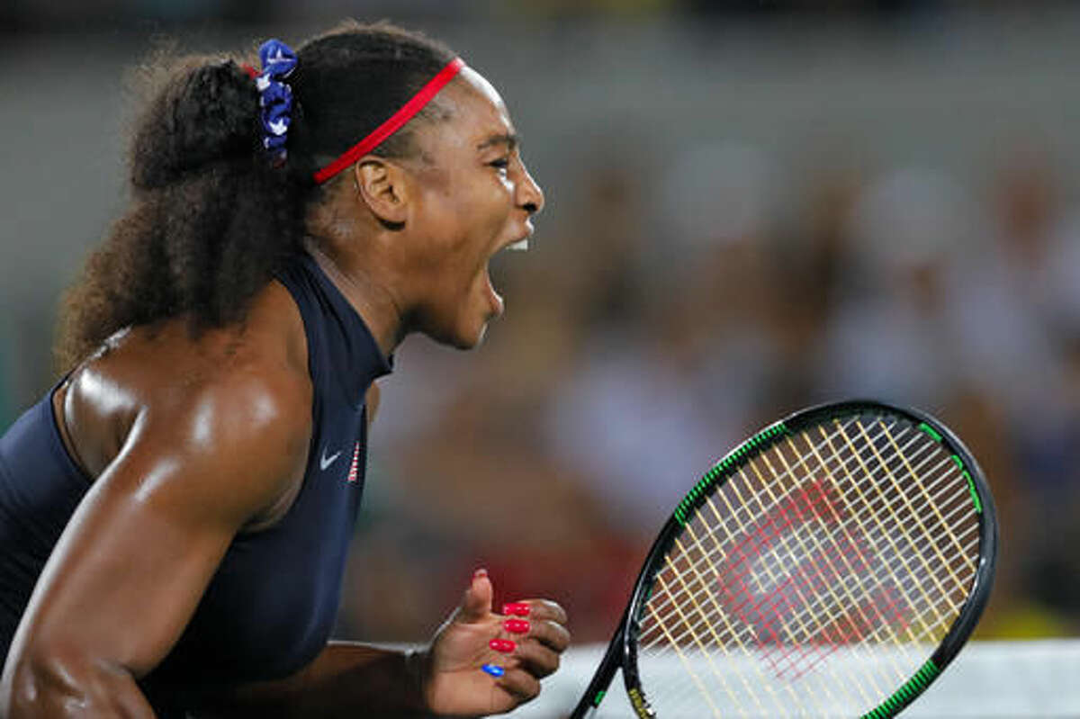 Serena Williams of the United States screams after winning a point in the match against France's Alize Cornet in the women's tennis competition at the 2016 Summer Olympics in Rio de Janeiro, Brazil, Monday, Aug. 8, 2016. (AP Photo/Vadim Ghirda)