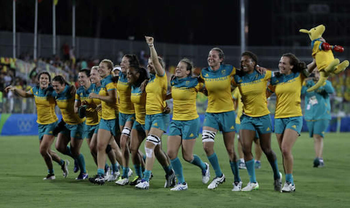 Australia's players celebrate after winning the women's rugby sevens gold medal match against New Zealand at the Summer Olympics in Rio de Janeiro, Brazil, Monday, Aug. 8, 2016. (AP Photo/Themba Hadebe)