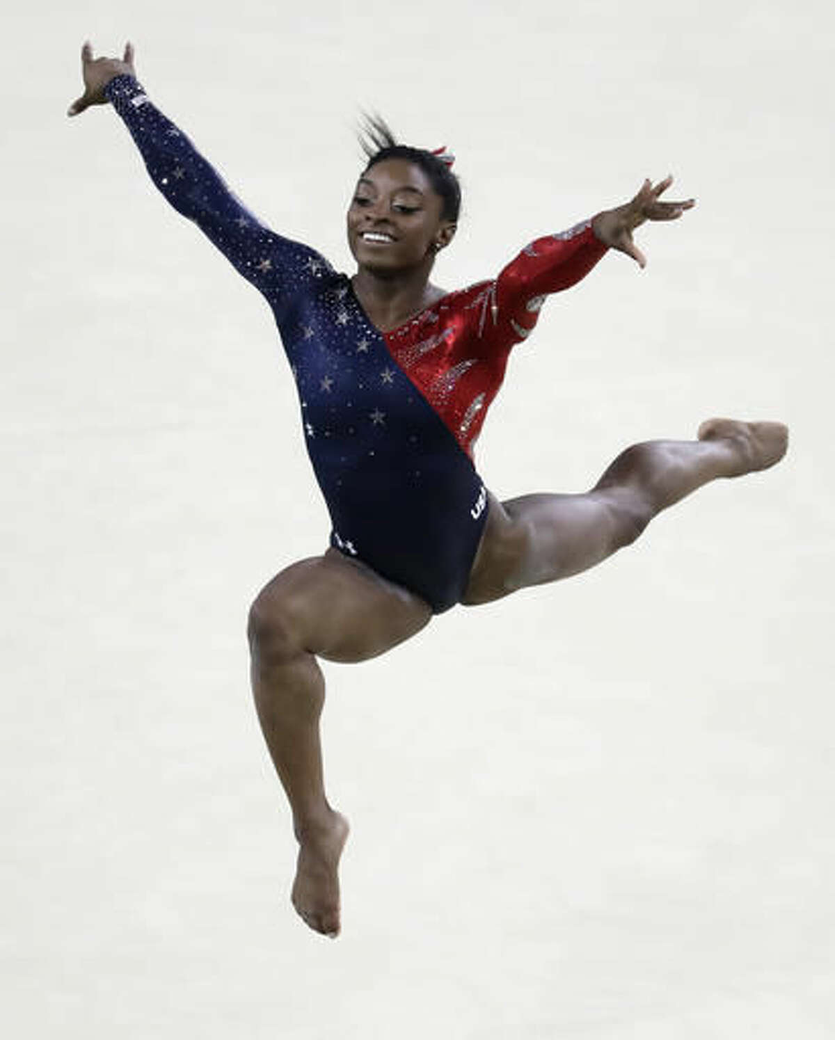 United States' Simone Biles performs on the floor during the artistic gymnastics women's qualification at the 2016 Summer Olympics in Rio de Janeiro, Brazil, Sunday, Aug. 7, 2016. (AP Photo/Dmitri Lovetsky)