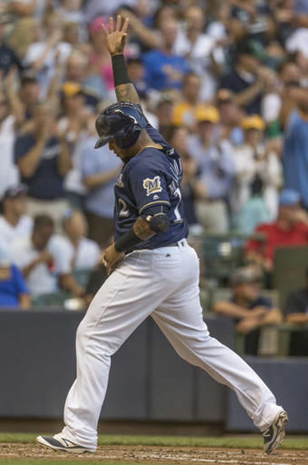 Milwaukee Brewers' Martin Maldonado reacts to his two run home run off of Atlanta Braves' Rob Whalen during the fifth inning of a baseball game, Monday, Aug. 8, 2016, in Milwaukee. (AP Photo/Tom Lynn)