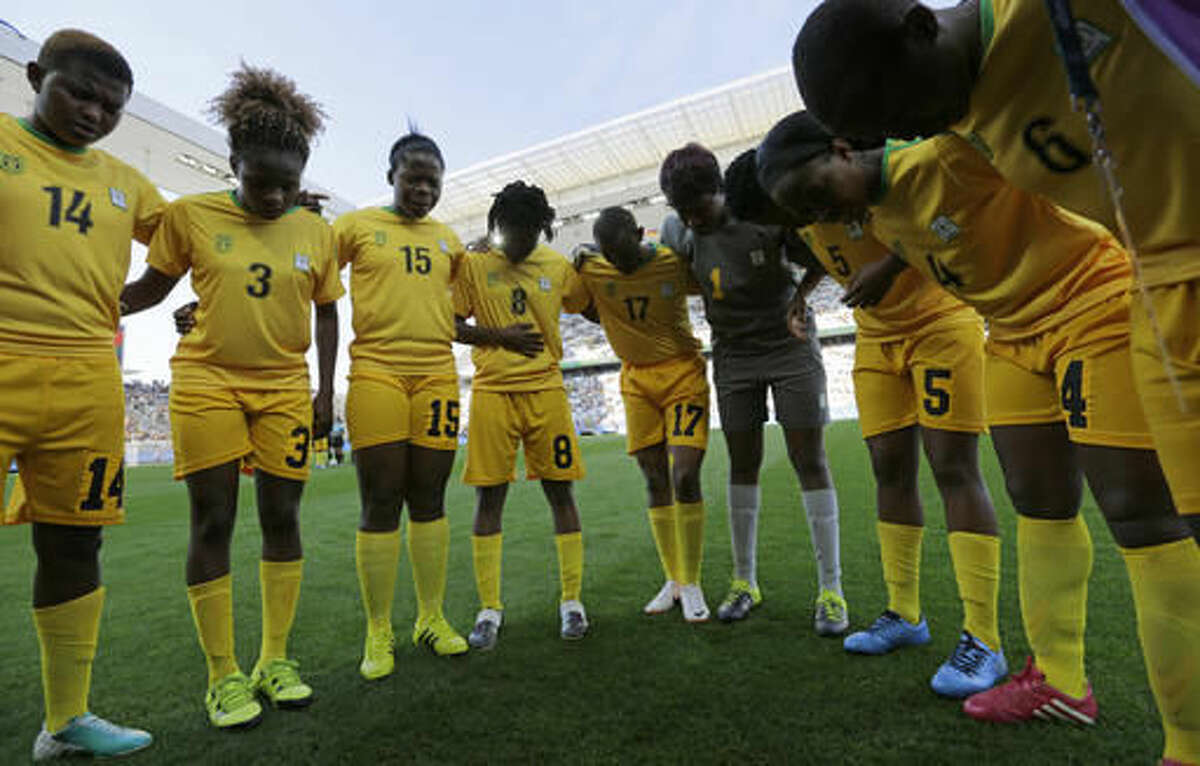 Zimbabwe's players confer prior to their group B match of the women's Olympic football tournament between against Canada in Sao Paulo, Brazil, Saturday, Aug. 6, 2016. (AP Photo/Nelson Antoine)