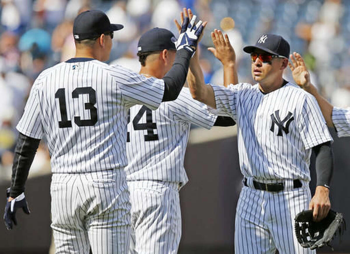 New York Yankees Alex Rodriguez, (13), who did not play, celebrates with Yankees center fielder Jacoby Ellsbury, right, and the Yankees Gary Sanchez, (24), center after the Yankees defeated the Cleveland Indians 3-2 in a baseball game in New York, Sunday, Aug. 7, 2016. New York Yankees. Rodriguez said he will play his final game Friday, Aug. 12, 2016, when the Yankees will unconditionally release him from his player contract so he can sign a contract to serve as a special advisor and instructor with the Yankees through Dec. 31, 2017. (AP Photo/Kathy Willens)