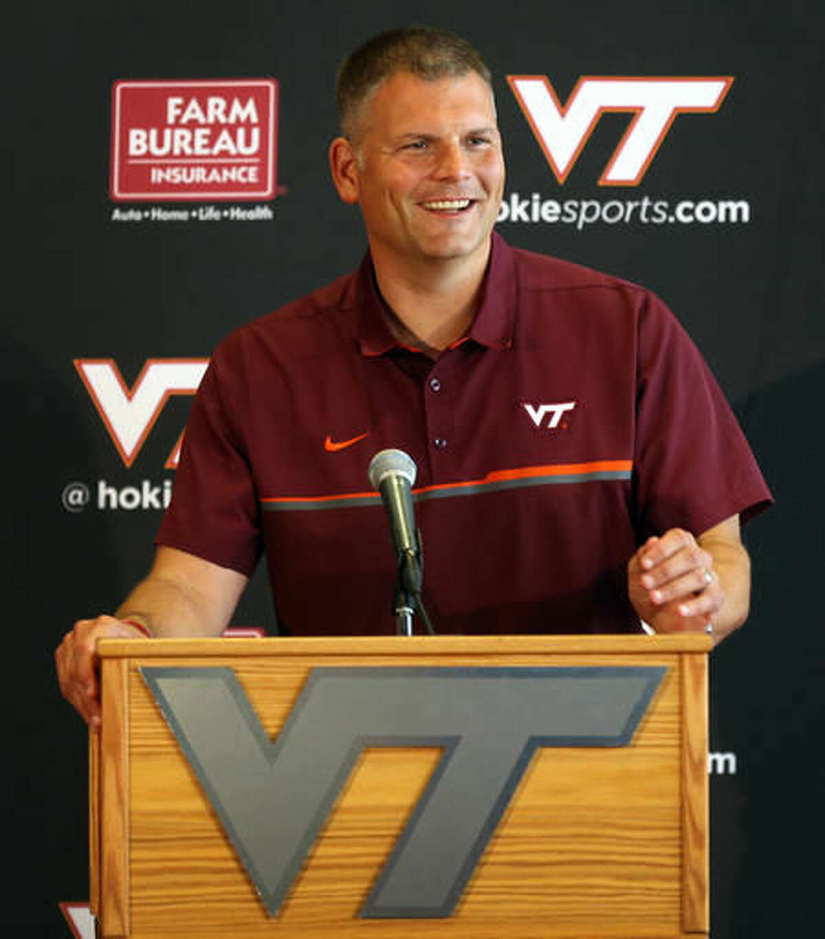 FILE - In this Aug. 2, 2016, file photo, Virginia Tech head football coach Justin Fuente addresses questions about his NCAA college football team during a preseason news conference in Blacksburg Va. Fuente has replaced longtime Hokies coach Frank Beamer. (Matt Gentry/The Roanoke Times via AP, File)