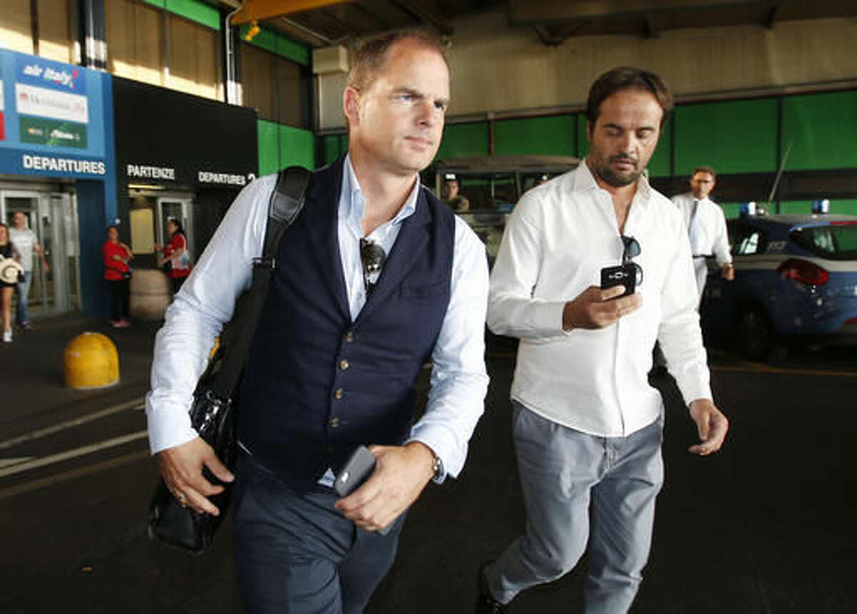 Dutch football manager Frank de Boer arrives at the Milan's Linate airport, Italy, Monday, Aug. 8, 2016. De Boer is to meet Inter Milan officials as he is expected to replace Roberto Mancini, who officially resigned today, as the new coach of the Milanese team. (AP Photo/Antonio Calanni)