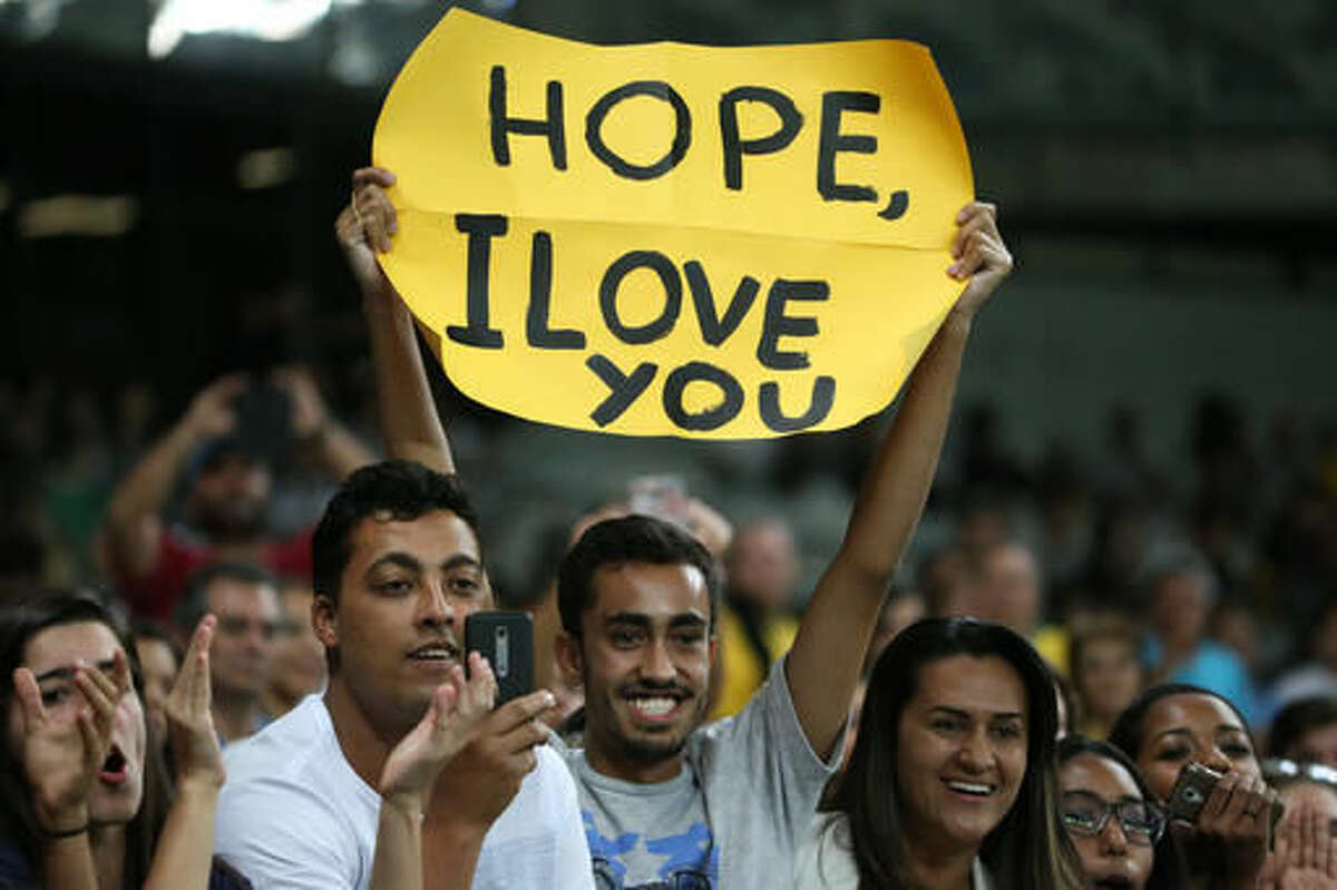 A fan of United States' goalkeeper Hope Solo, holds a sign that reads "Hope, I Love You" during a group G match of the women's Olympic football tournament between United States and France at the Mineirao stadium in Belo Horizonte, Brazil, Saturday, Aug. 6, 2016. United States won 1-0. (AP Photo/Eugenio Savio)