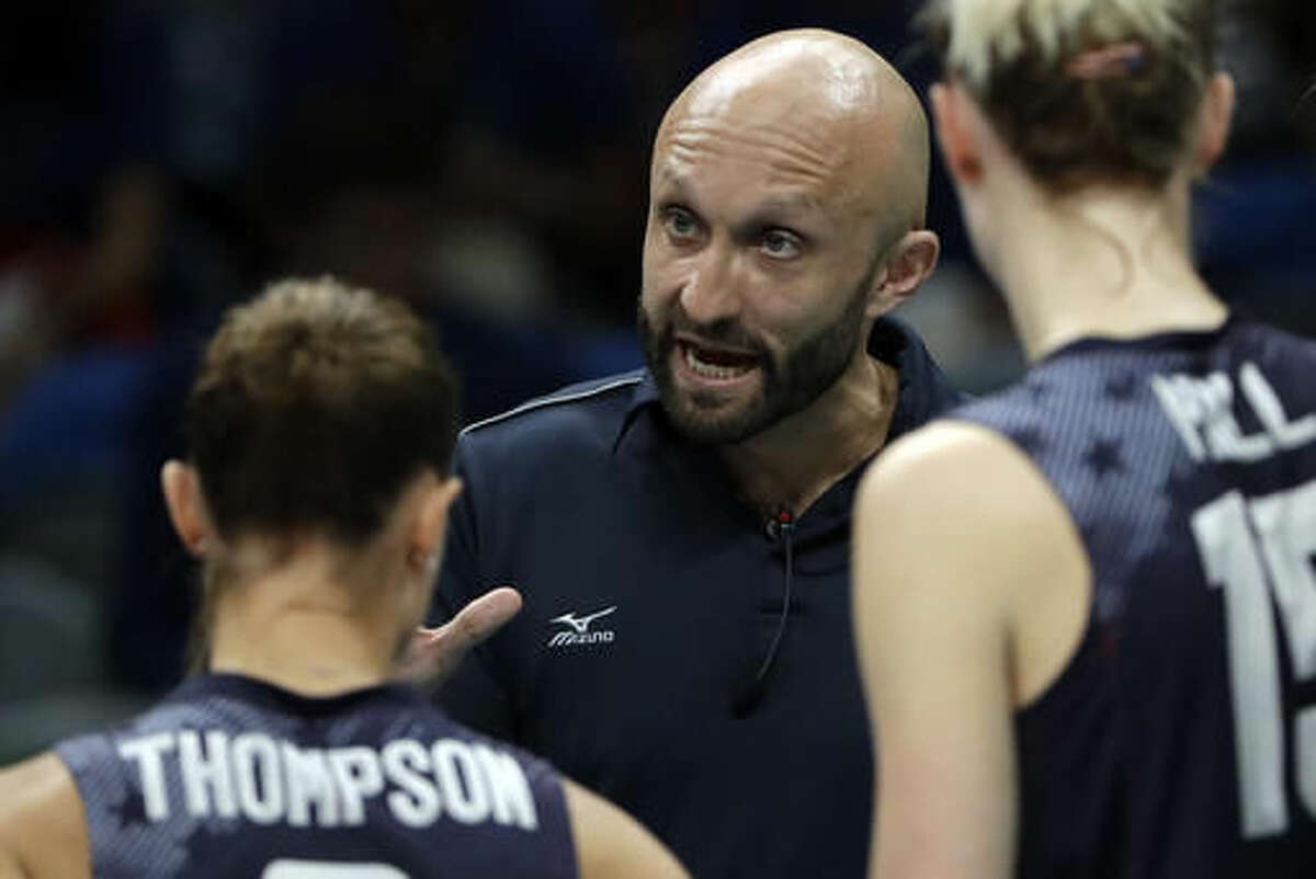 United States assistant coach Jamie Morrison meets with the team during a women's preliminary volleyball match against Netherlands at the 2016 Summer Olympics in Rio de Janeiro, Brazil, Monday, Aug. 8, 2016. (AP Photo/Matt Rourke)