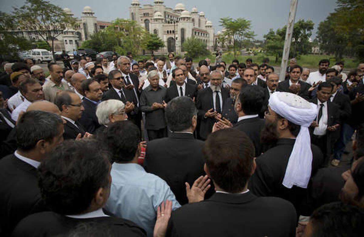 Pakistani lawyers offer funeral prayers for their colleagues killed in a Monday bombing in Quetta, outside the Supreme Court building in Islamabad, Pakistan, Tuesday, Aug. 9, 2016. Pakistani lawyers are mourning colleagues slain in a shocking suicide bombing the previous day in the southwestern city of Quetta that killed and wounded scores of people, mostly lawyers. (AP Photo/B.K. Bangash)