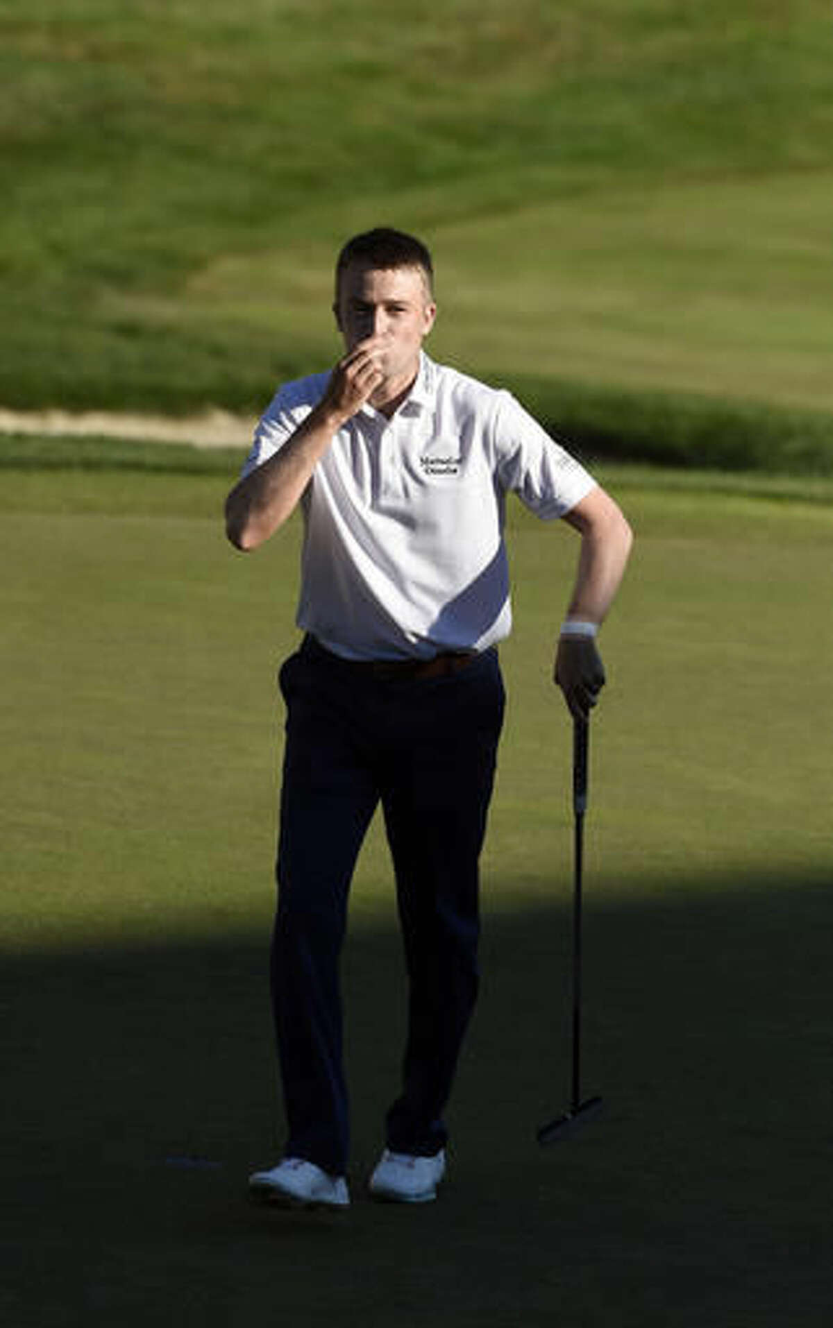 Russell Knox, from Scotland, celebrates after his winning putt on the 18th hole during the final round of the Travelers Championship golf tournament in Cromwell, Conn., Sunday, Aug. 7, 2016. (AP Photo/Fred Beckham)