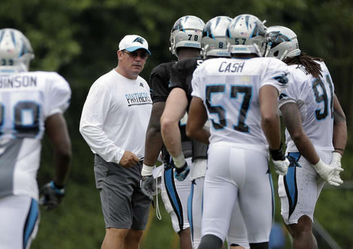 Carolina Panthers head coach Ron Rivera, center, stops players during a drill during an NFL training camp practice in Spartanburg, S.C., Monday, Aug. 8, 2016. (AP Photo/Chuck Burton)