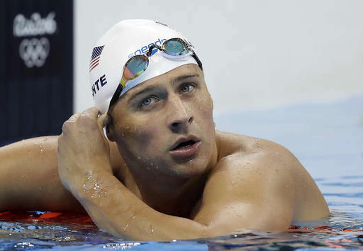 United States' Ryan Lochte checks his time in a men's 4x200-meter freestyle heat during the swimming competitions at the 2016 Summer Olympics, Tuesday, Aug. 9, 2016, in Rio de Janeiro, Brazil. (AP Photo/Michael Sohn)