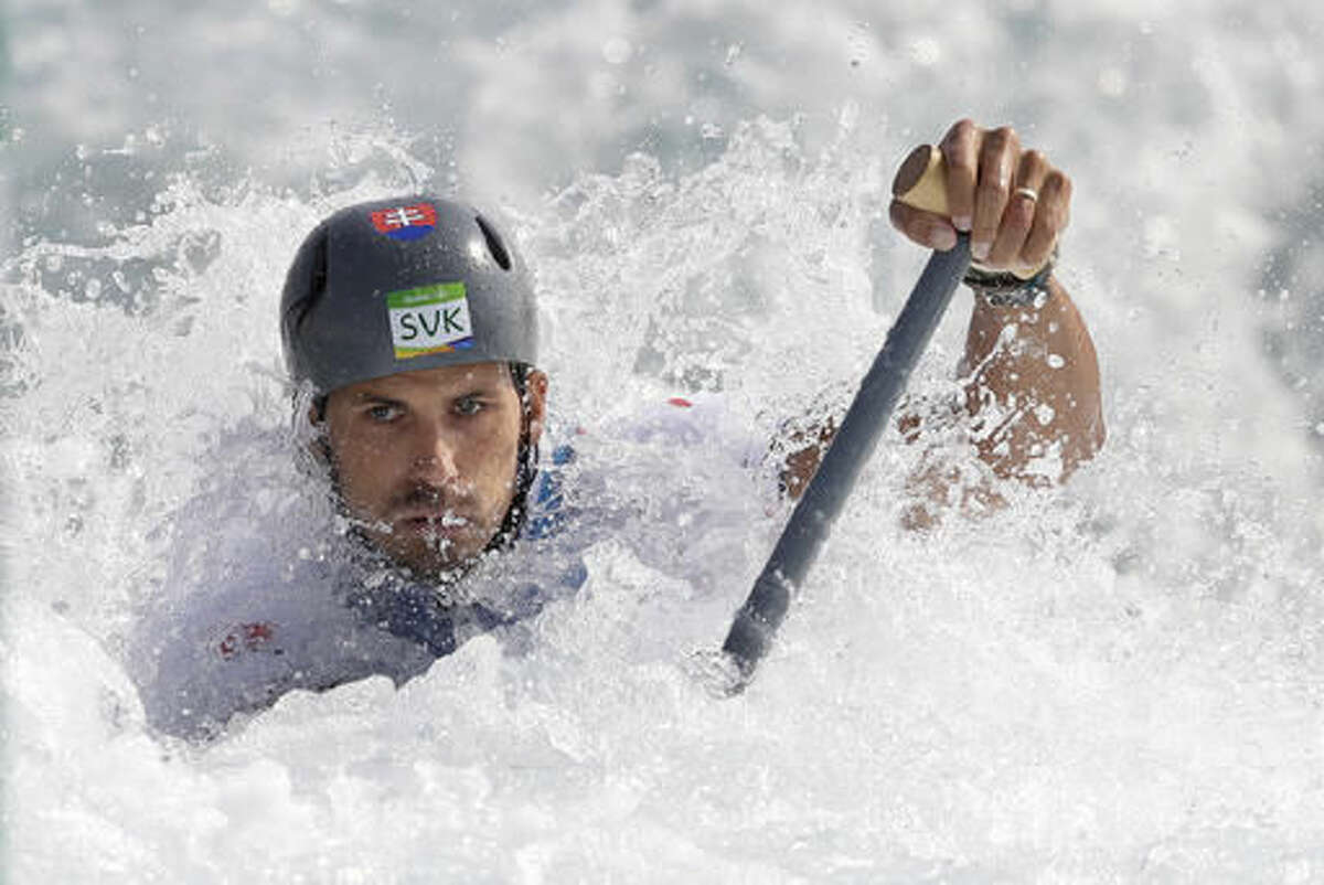 Siver medal winner Matej Benus of Slovakia competes during the canoe single C1 men's semifinal of the Canoe Slalom at the 2016 Summer Olympics in Rio de Janeiro, Brazil, Tuesday, Aug. 9, 2016. (AP Photo/Kirsty Wigglesworth)