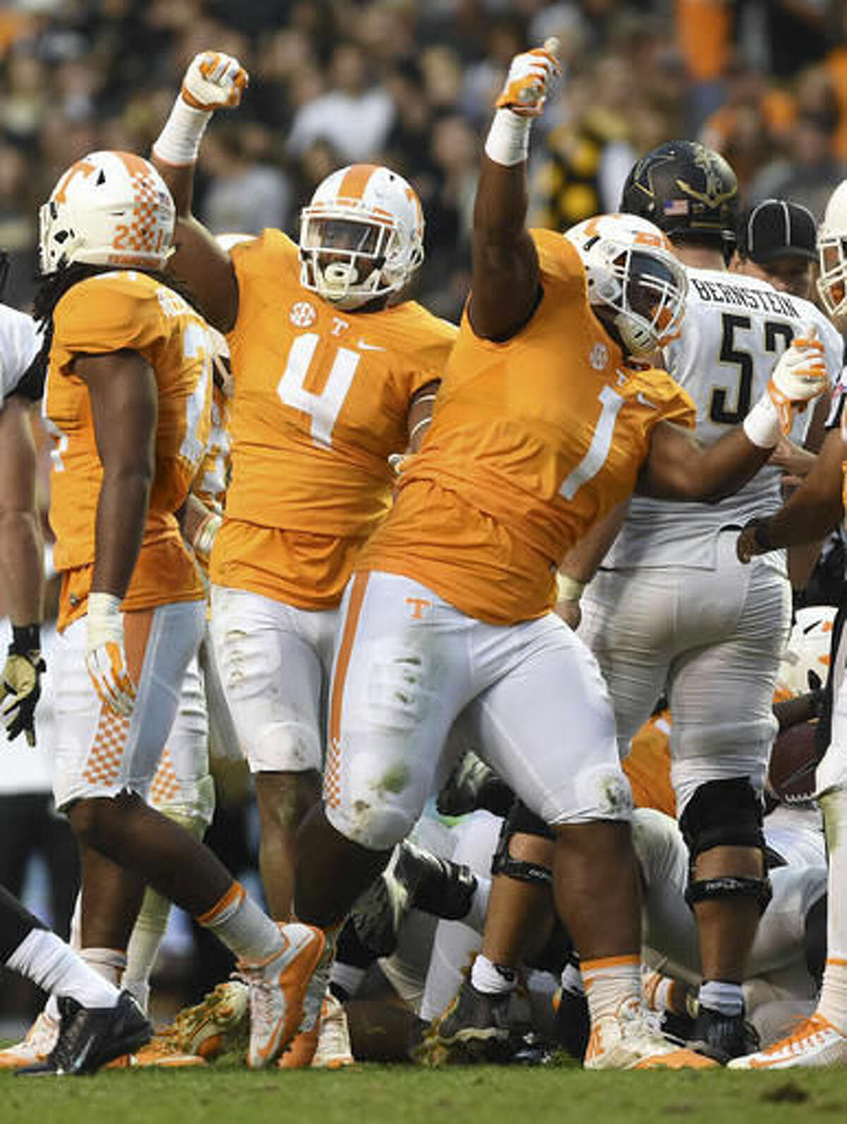 Tennessee defensive linemen Kahlil McKenzie, right, and LaTroy Lewis celebrate after making a play against Vanderbilt during a NCAA football game Saturday, Nov. 28, 2015, in Knoxville, Tenn. (Adam Lau/Knoxville News Sentinel via AP)