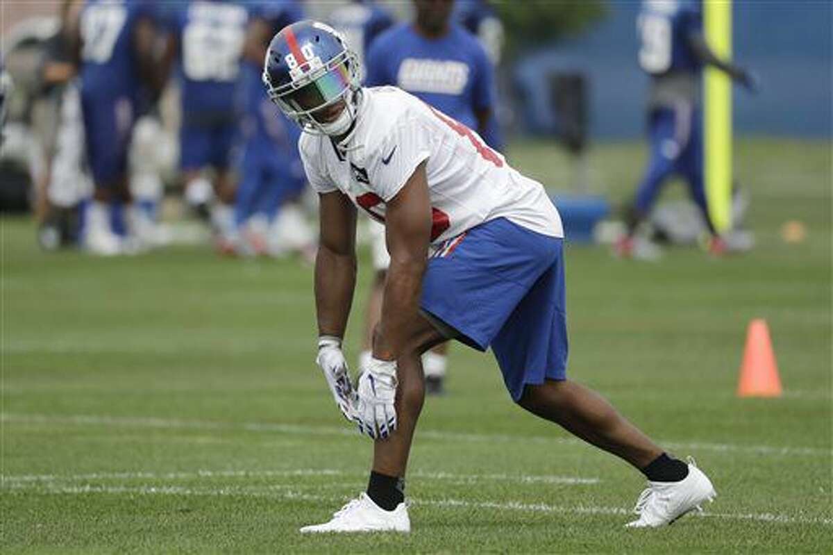 FILE- In this July 30, 2016, file photo, New York Giants wide receiver Victor Cruz lines up to run a drill during NFL football training camp in East Rutherford, N.J. The wide receiver, who missed all of last season with a calf injury and has been limited to six regular-season games in the last two years, is looking iffy for the Giants’ preseason opener against the Miami Dolphins after sustaining a groin injury in practice Tuesday, Aug. 9, 2016. (AP Photo/Julio Cortez, File)