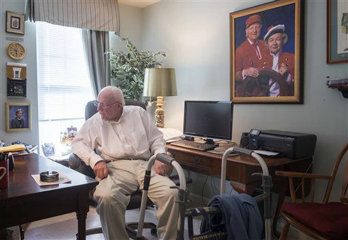 This March 3, 2016, photo shows a portrait of W. Carter Merbreier, surrounded by a lifetime of memories in his home in Audubon, Pa. Merbreier helmed beloved Philadelphia children's TV show "Captain Noah and his Magical Ark" for 27 years. He died Tuesday, Aug. 9, at age 90. (Ed Hille/The Philadelphia Inquirer via AP)