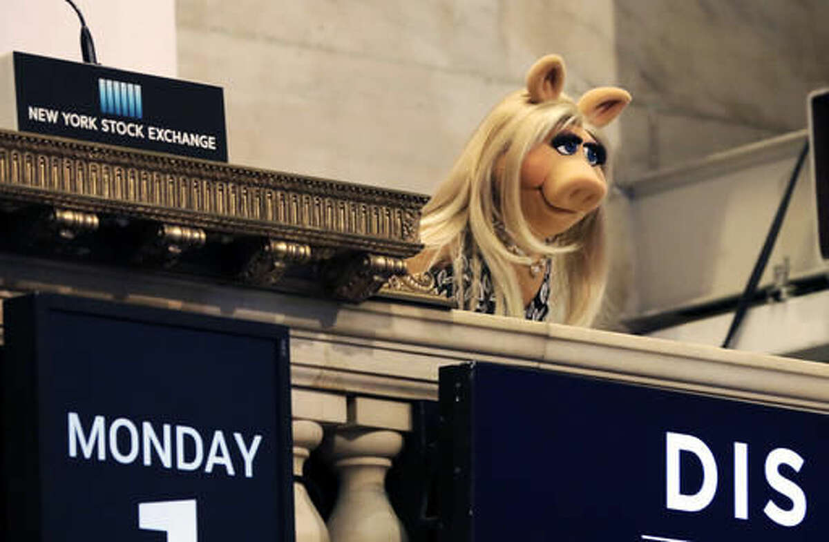 FILE - In this Monday, Feb. 1, 2016, file photo, Miss Piggy overlooks the New York Stock Exchange trading floor after ringing the opening bell to highlight Disney's "The Muppets" television show. Walt Disney reports financial results Tuesday, Aug. 9, 2016. (AP Photo/Richard Drew, File)