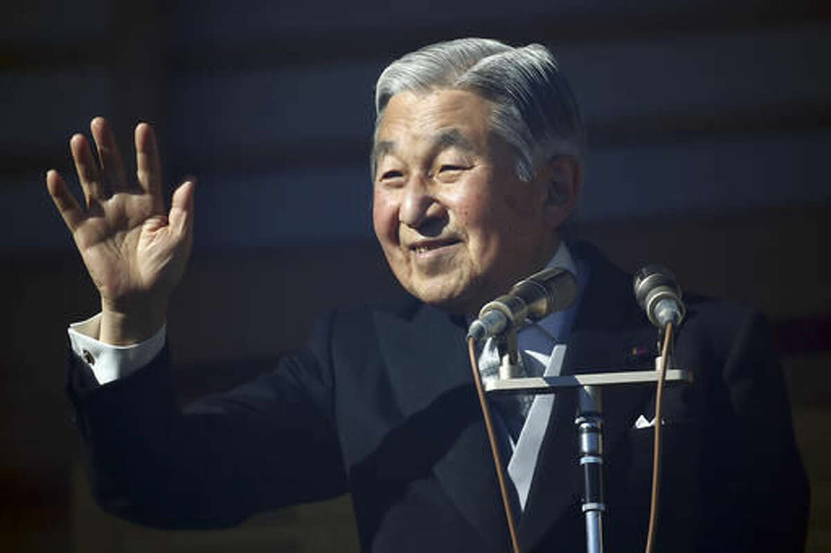 In this Dec. 23, 2014 file photo, Japan's Emperor Akihito waves to well-wishers as he and family members appear on the balcony of the Imperial Palace during the emperor's 81th birthday in Tokyo. Japanese will tune in to Emperor Akihito’s rare video message Monday, Aug. 8, 2016 following reports that he would abdicate in the next few years, which initially came as shock but which many people appeared to have welcomed as a deserved rest for the 82-year-old beloved monarch. (AP Photo/Eugene Hoshiko, File)