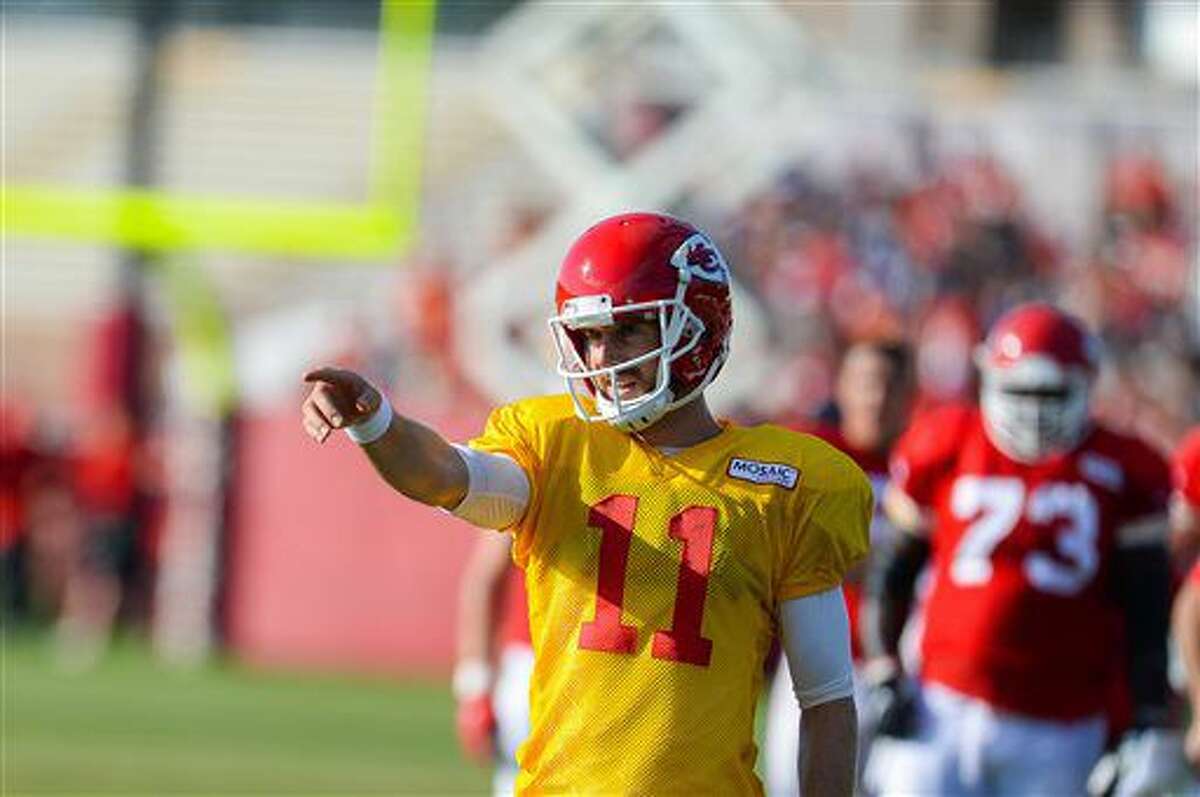 Kansas City Chiefs quarterback Alex Smith calls out the play before the team practices various drills during NFL football training camp Saturday, Aug. 6, 2016, in St. Joseph, Mo. (Dougal Brownlie/The St. Joseph News-Press via AP)