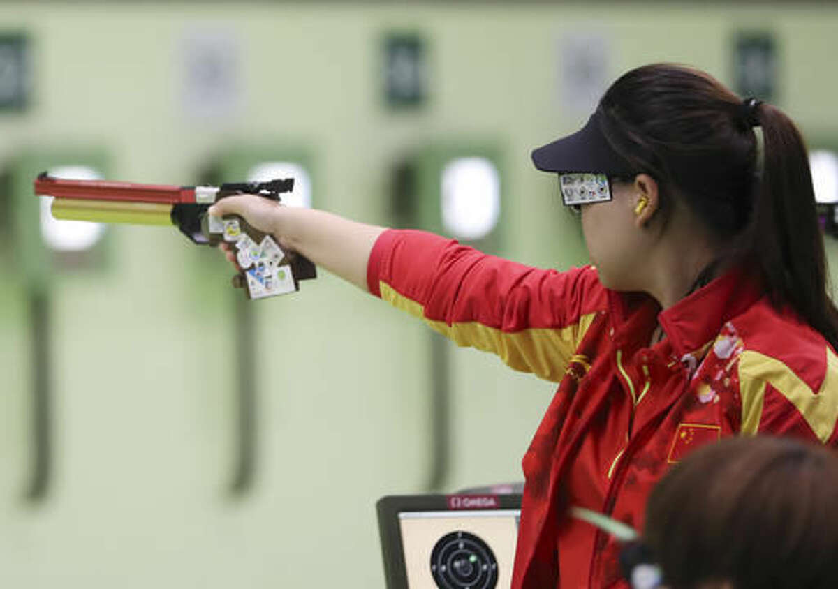 Zhang Mengxue of China competes during the women's 10-meter air pistol qualification at Olympic Shooting Center at the 2016 Summer Olympics in Rio de Janeiro, Brazil, Sunday, Aug. 7, 2016. Zhang won the gold medal for the event. (AP Photo/Eugene Hoshiko)