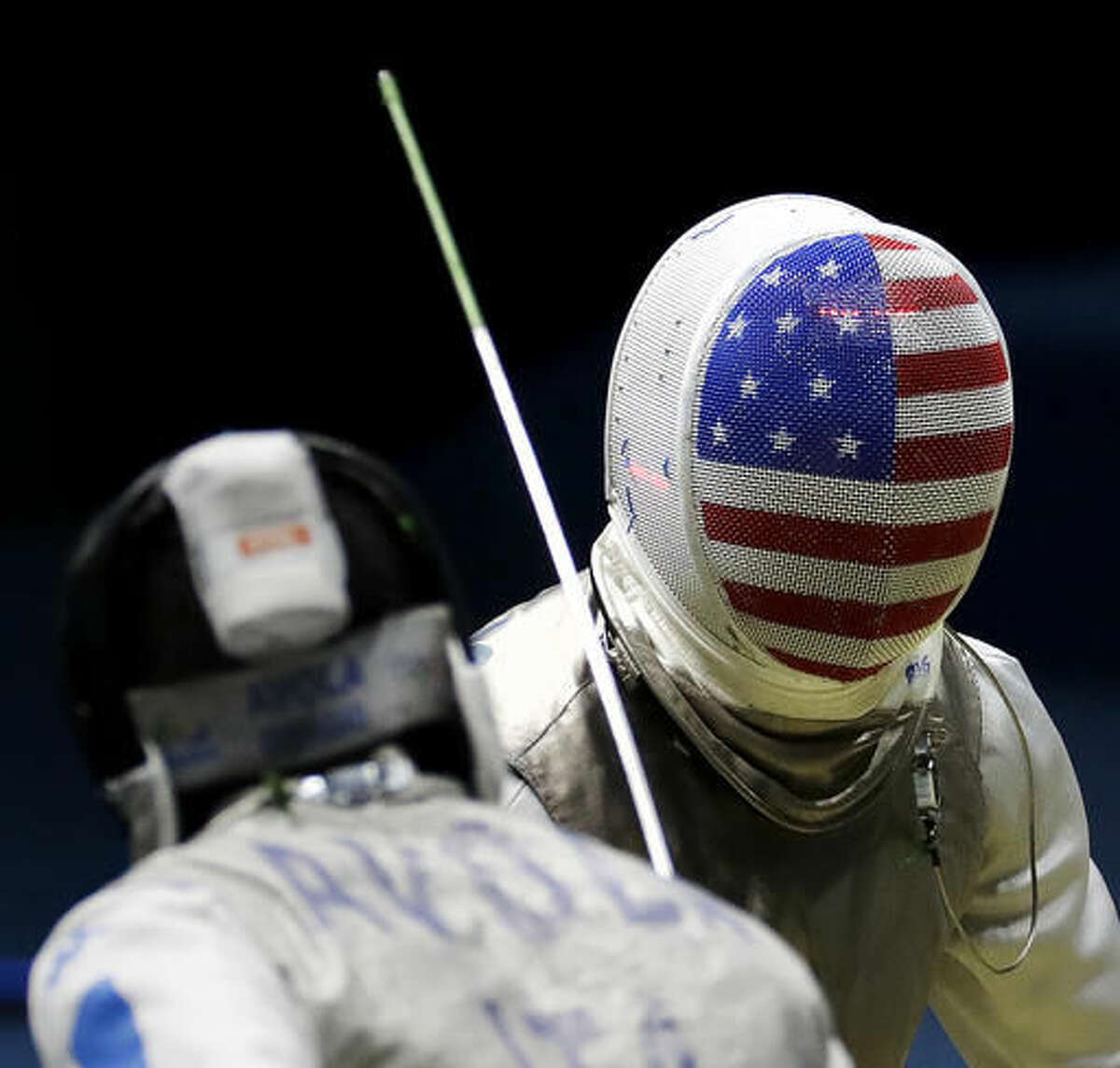 Alexander Massialas, of the United States, competes against Italy's Giorgio Avola in a men's individual foil fencing quarterfinal at the 2016 Summer Olympics in Rio de Janeiro, Brazil, Sunday, Aug. 7, 2016. (AP Photo/Charlie Riedel)