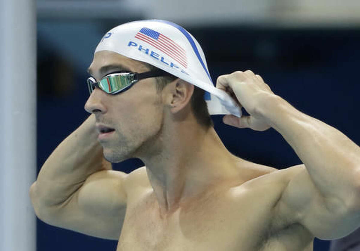 FILE - In this Aug. 2, 2016 file photo, United States' Michael Phelps prepares for a swimming training session at the 2016 Summer Olympics in Rio de Janeiro, Brazil. Phelps swims in preliminaries of the men’s 200 meter butterfly Monday, Aug. 8. He holds the world and Olympic records in the event. (AP Photo/Matt Slocum, File)