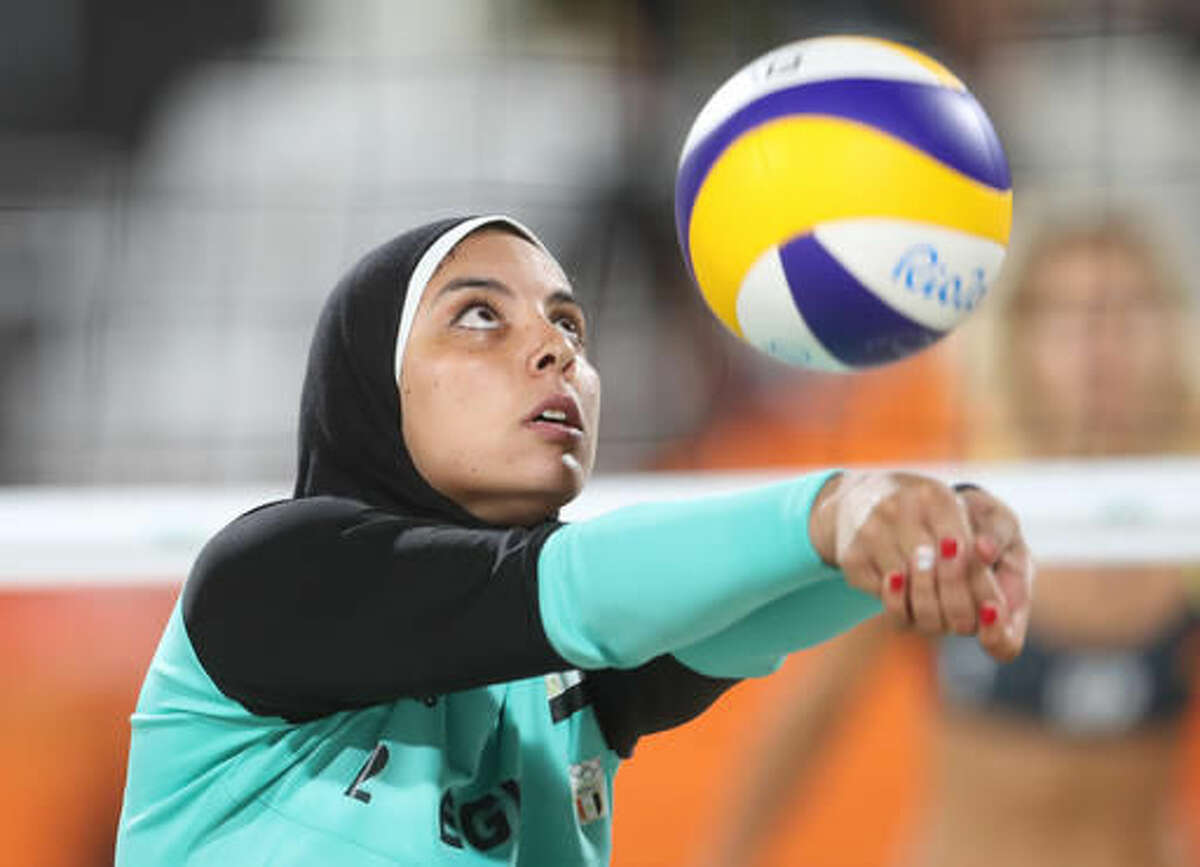 Egypt's Doaa Elghobashy passes a ball during a women's beach volleyball match against Germany at the 2016 Summer Olympics in Rio de Janeiro, Brazil, Sunday, Aug. 7, 2016. (AP Photo/Petr David Josek)