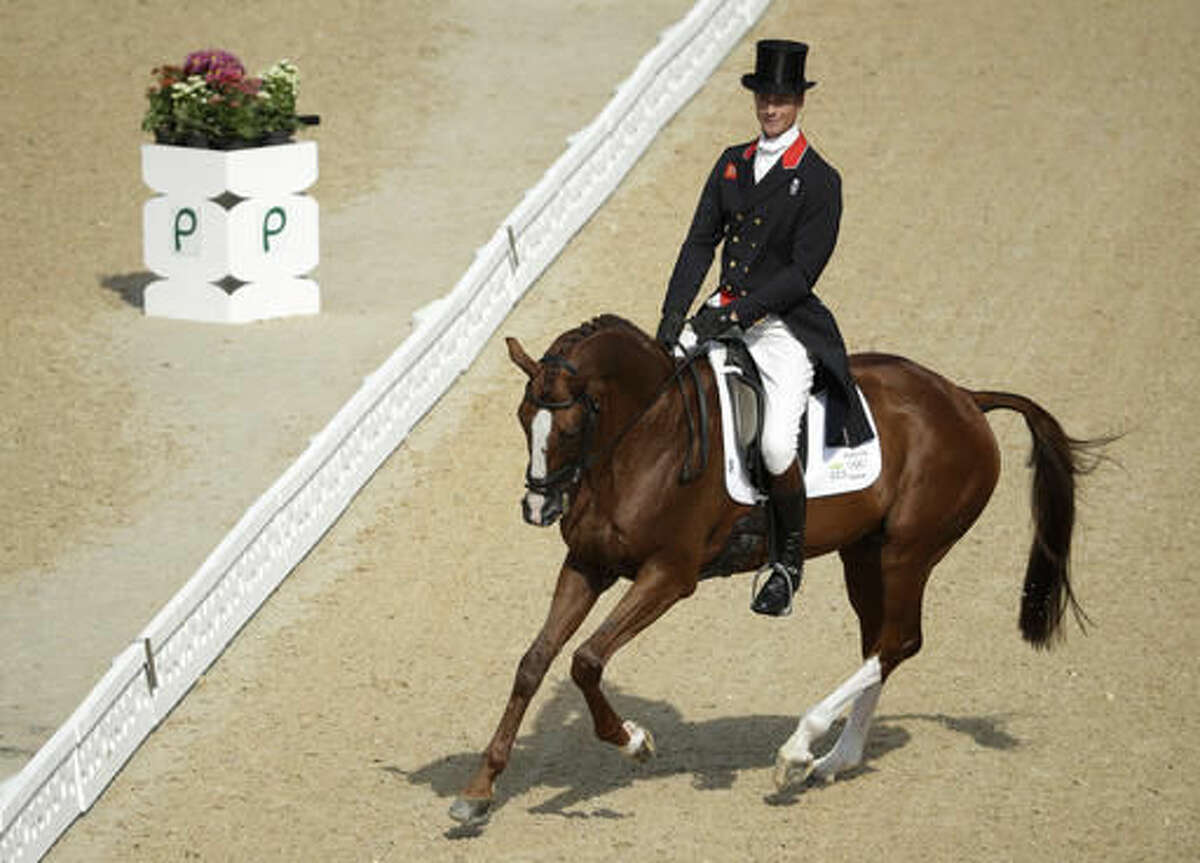 William Fox-Pitt, of Great Britain, rides Chilli Morning in the equestrian eventing dressage competition at the 2016 Summer Olympics in Rio de Janeiro, Brazil, Saturday, Aug. 6, 2016. (AP Photo/John Locher)