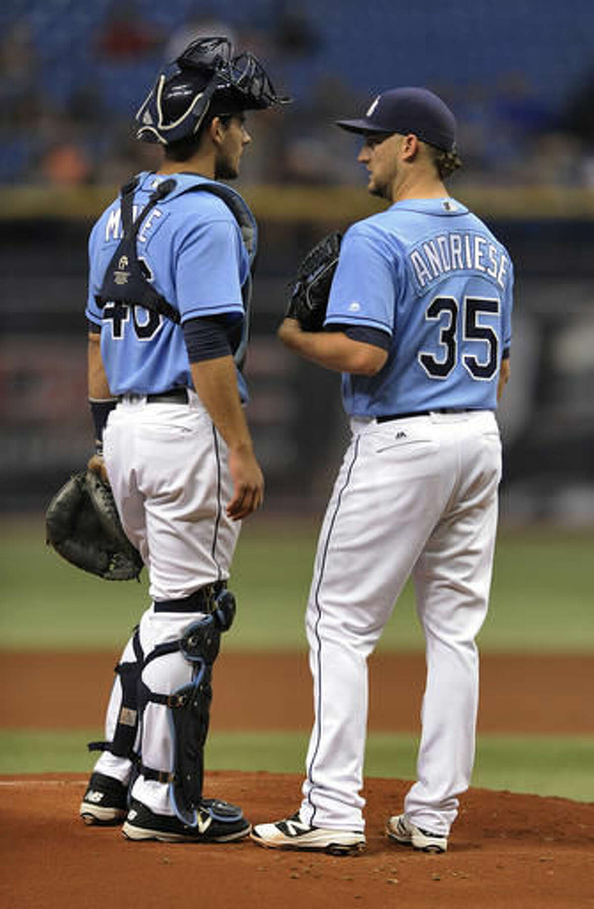 Tampa Bay Rays catcher Luke Maile, left, talks with starter Matt Andriese, right, on the mound during the first inning of a baseball game against the Minnesota Twins, Sunday, Aug. 7, 2016, in St. Petersburg, Fla. (AP Photo/Steve Nesius