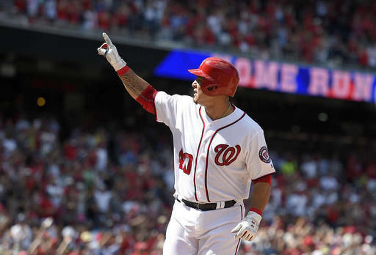 Washington Nationals' Wilson Ramos celebrates his home run during the seventh inning of a baseball game against the San Francisco Giants, Sunday, Aug. 7, 2016, in Washington. The Nationals won 1-0. (AP Photo/Nick Wass)