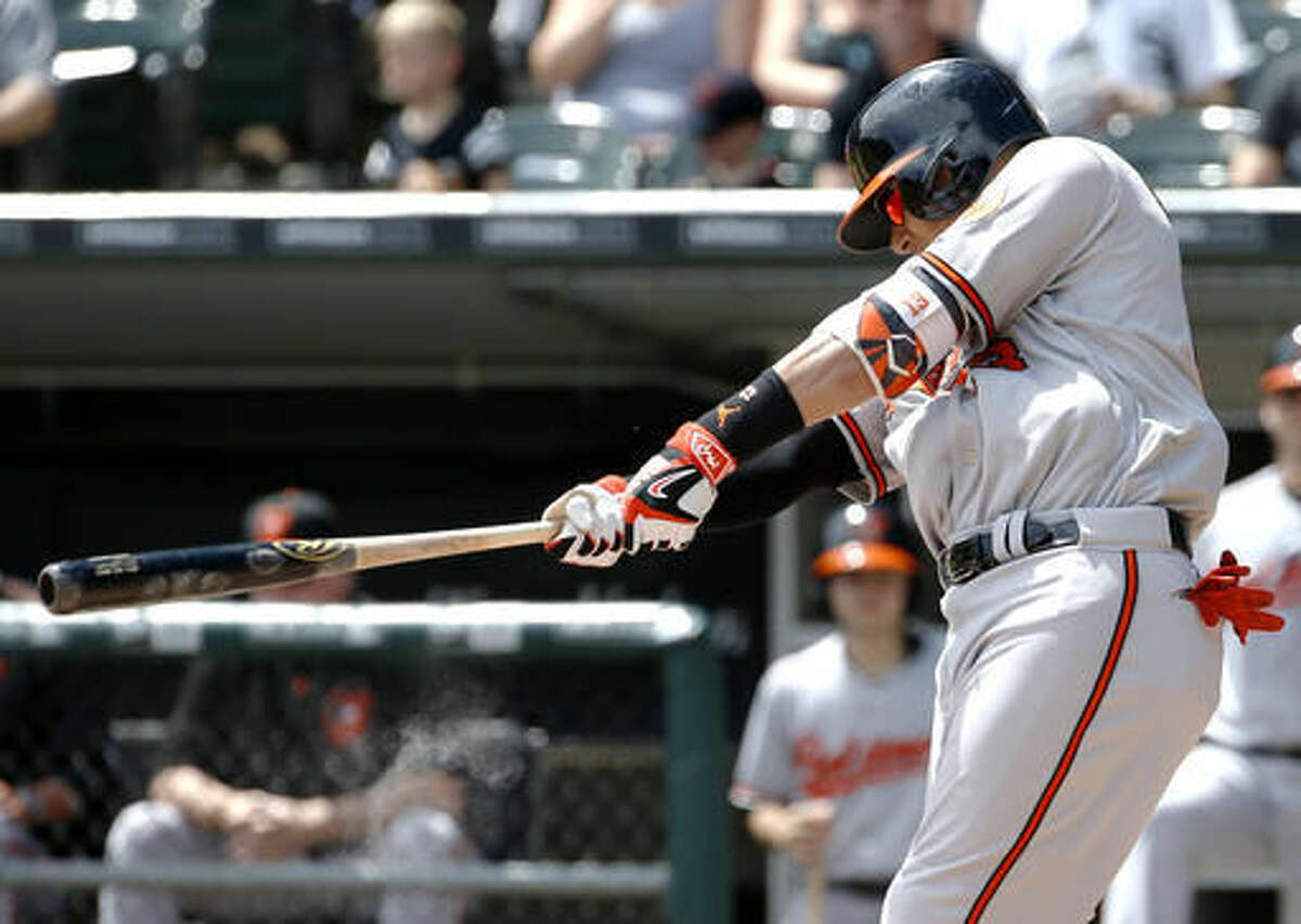 Baltimore Orioles' Manny Machado hits a two-run home run against the Chicago White Sox during the first inning of a baseball game in Chicago, Sunday, Aug. 7, 2016. (AP Photo/Nam Y. Huh)