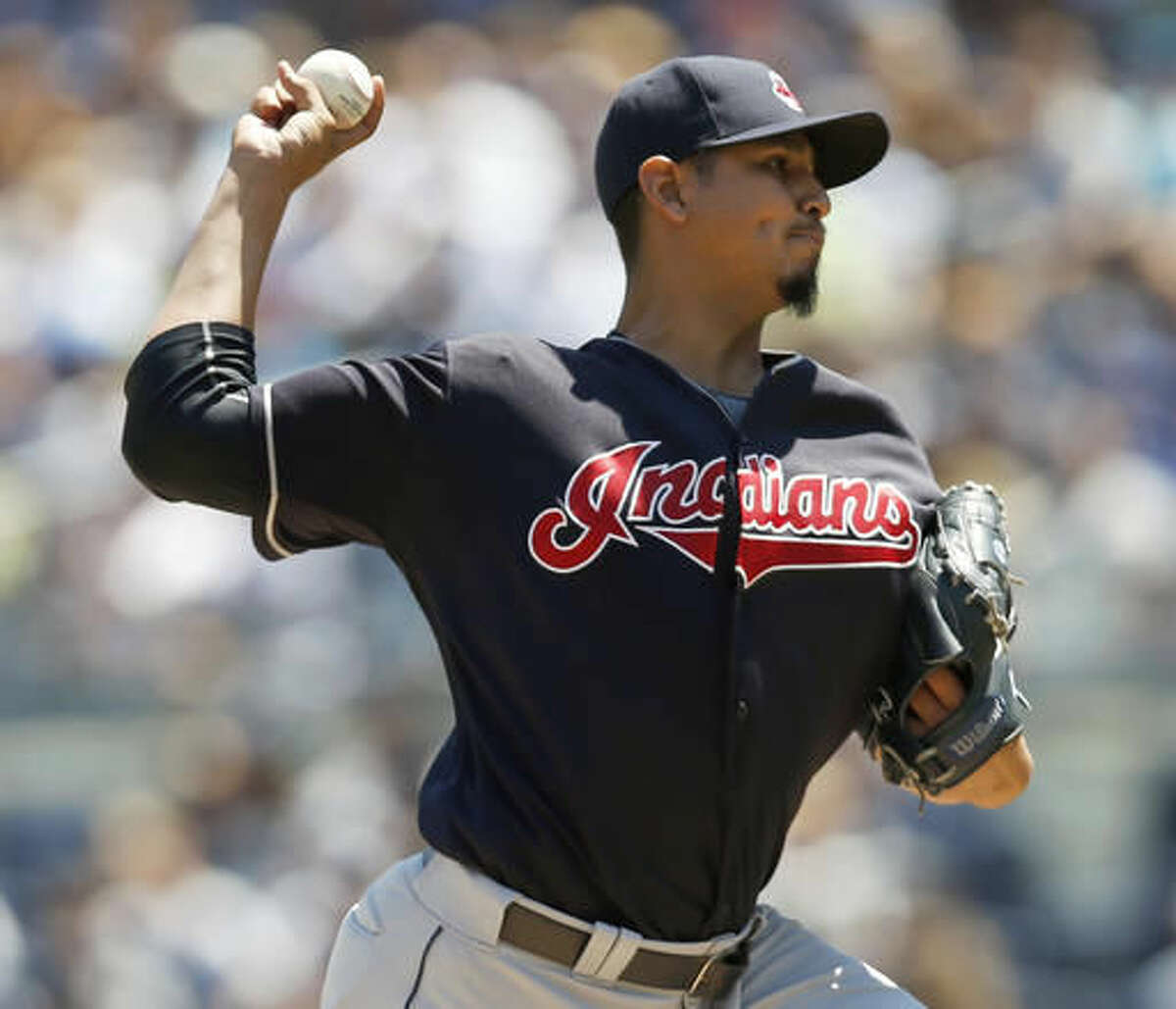 Cleveland Indians starting pitcher Carlos Carrasco delivers during the first inning of a baseball game against the New York Yankees, Sunday, Aug. 7, 2016, in New York. (AP Photo/Kathy Willens)