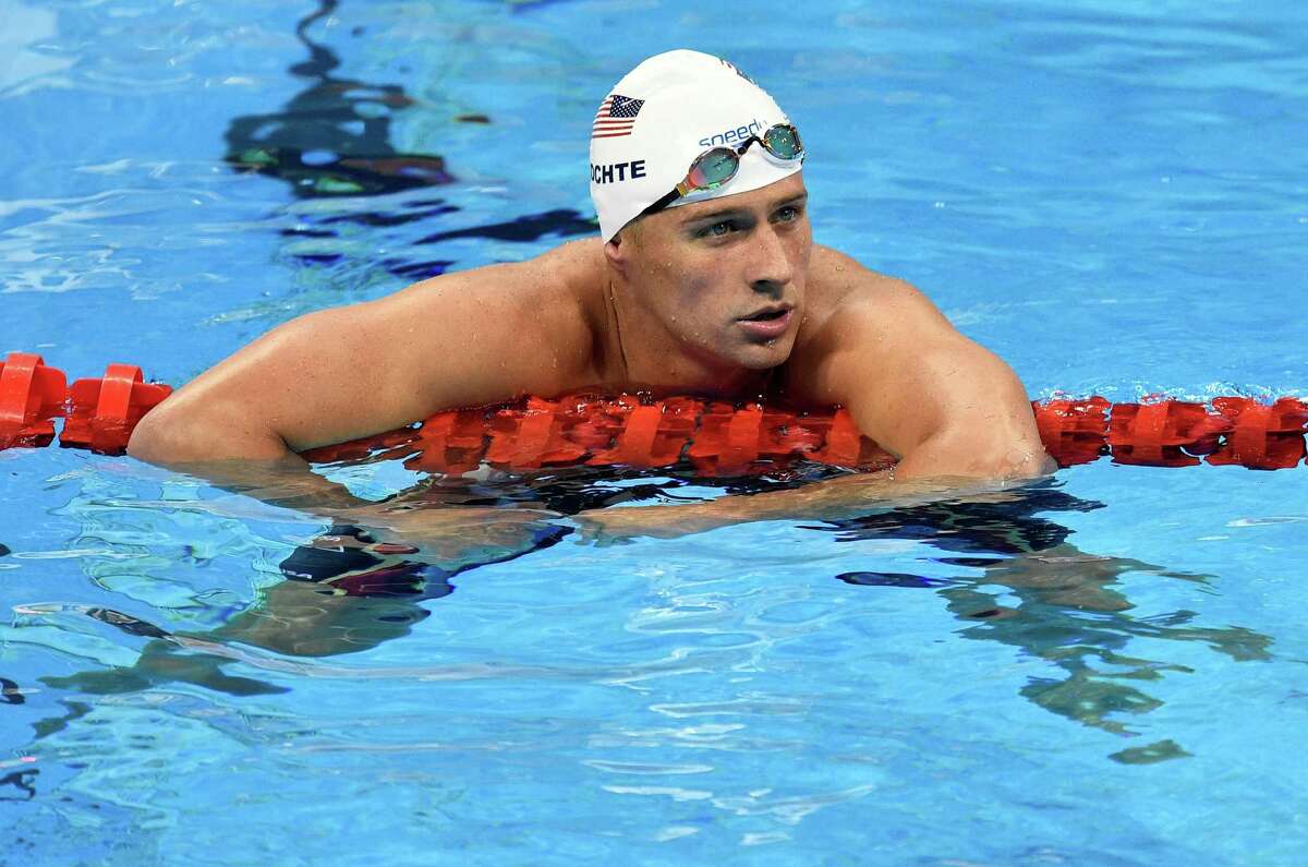 FILE - In this Aug. 9, 2016, file photo, United States' Ryan Lochte checks his time after a men' 4x200-meter freestyle relay heat during the swimming competitions at the 2016 Summer Olympics in Rio de Janeiro, Brazil. The father of the American swimmer said Wednesday, Aug. 17, his son arrived back in the United States before a Brazilian judge ordered that Lochte stay in Brazil as authorities investigate a robbery claim involving the athlete during the Olympics. (AP Photo/Martin Meissner, File)