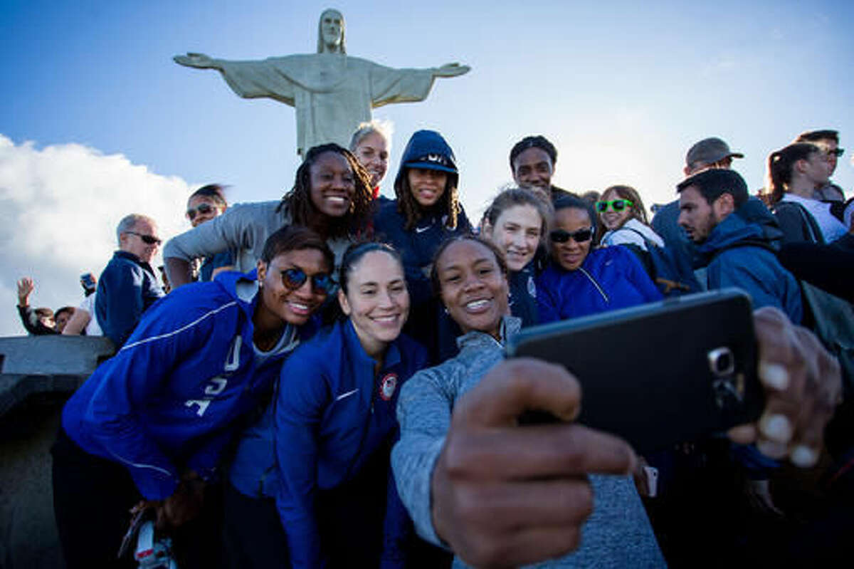 Members of the United States basketball women team visit the Christ the Redeemer statue during the 2016 Summer Olympics in Rio de Janeiro, Thursday, Aug.11, 2016. (AP Photo/Mauro Pimentel)