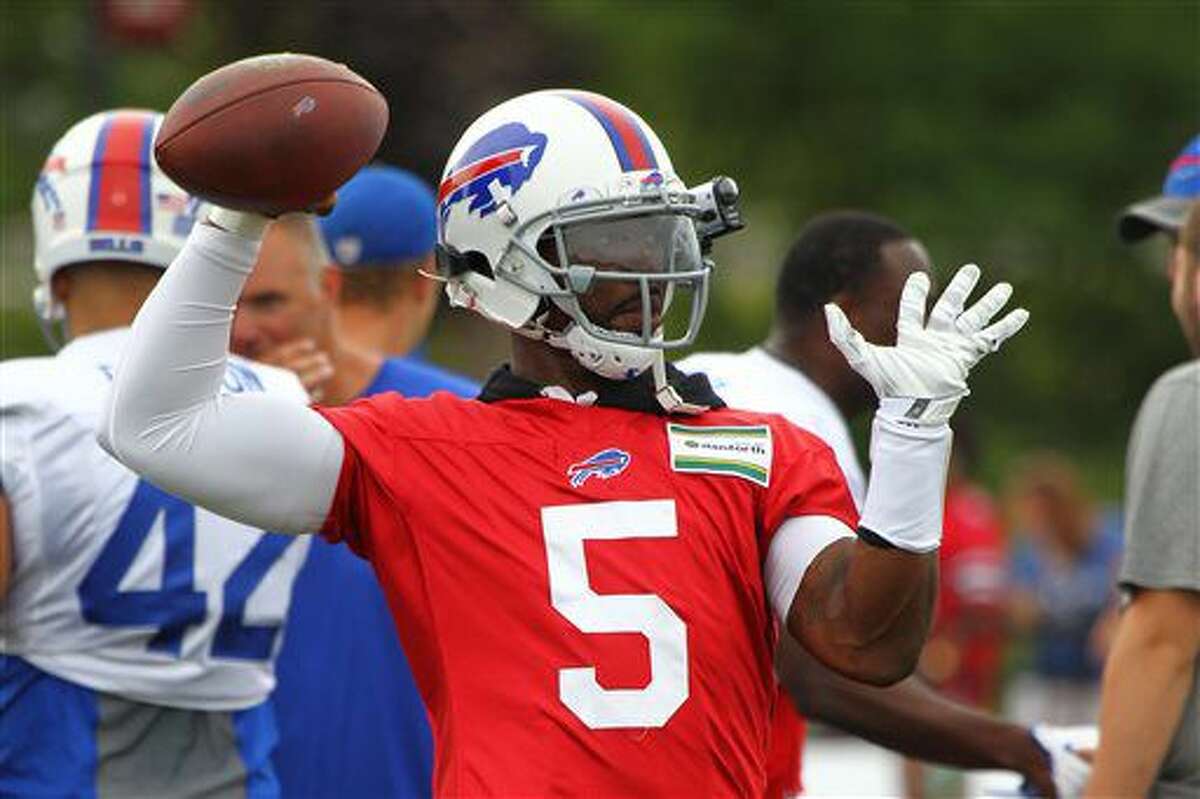 FILE - In this July 30, 2016, file photo, Buffalo Bills quarteback Tyrod Taylor throws a pass during NFL football training camp in Pittsford, N.Y. The Bills have placed their faith in quarterback Tyrod Taylor by signing him to a contract extension. (AP Photo/Jeffrey T. Barnes, File)
