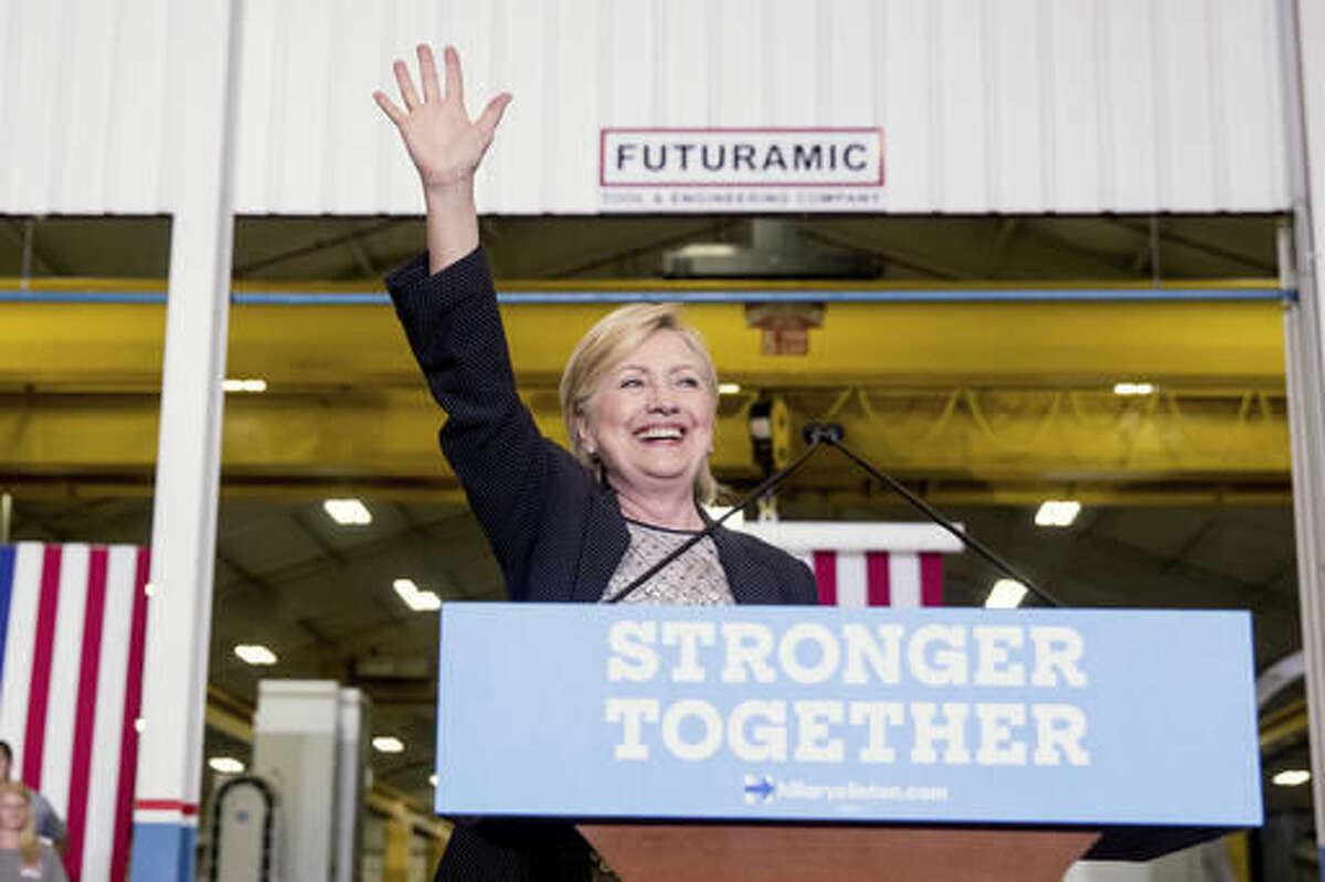 Democratic presidential candidate Hillary Clinton waves as she finishes a speech on the economy after touring Futuramic Tool & Engineering, in Warren, Mich., Thursday, Aug. 11, 2016. (AP Photo/Andrew Harnik)