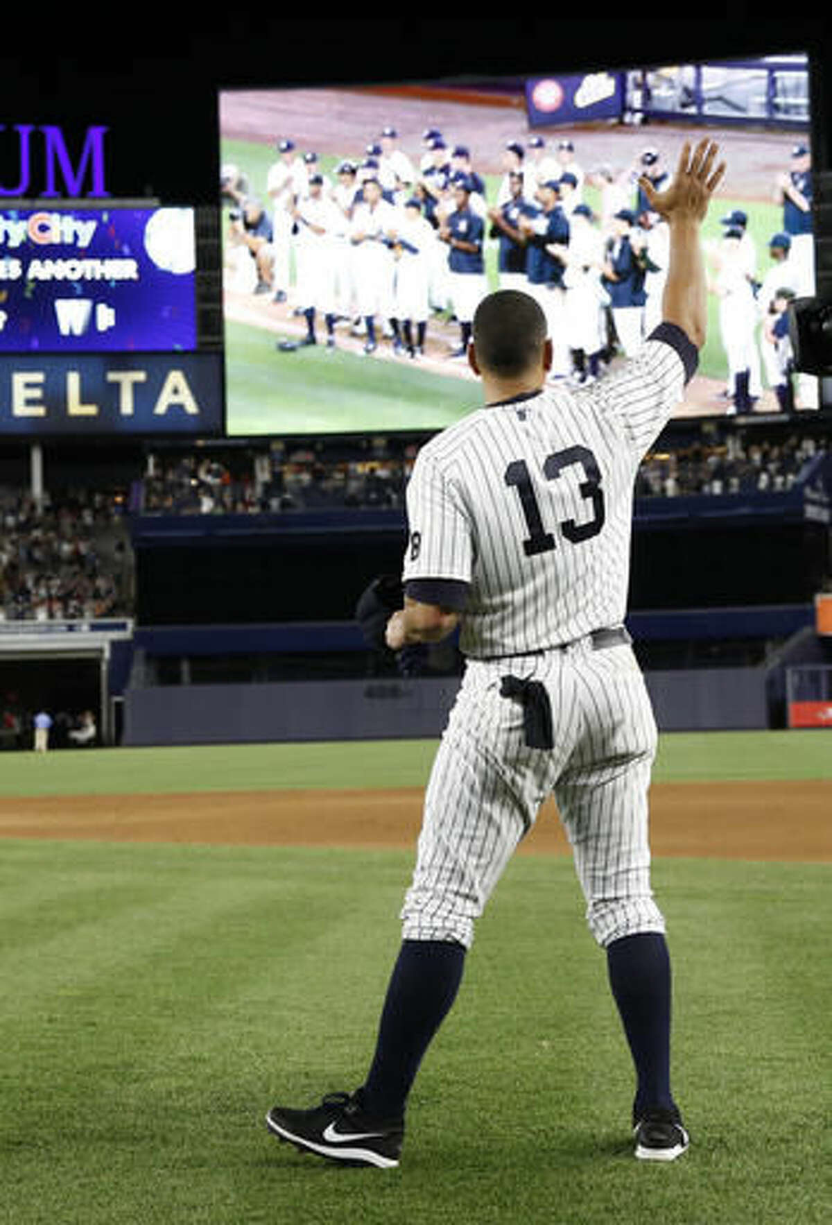 New York Yankees' Alex Rodriguez (13) waves goodbye to fans after playing in his final baseball game as a Yankee against the Tampa Bay Rays at Yankee Stadium in New York, Friday, Aug. 12, 2016. The Yankees won 6-3. (AP Photo/Kathy Willens)