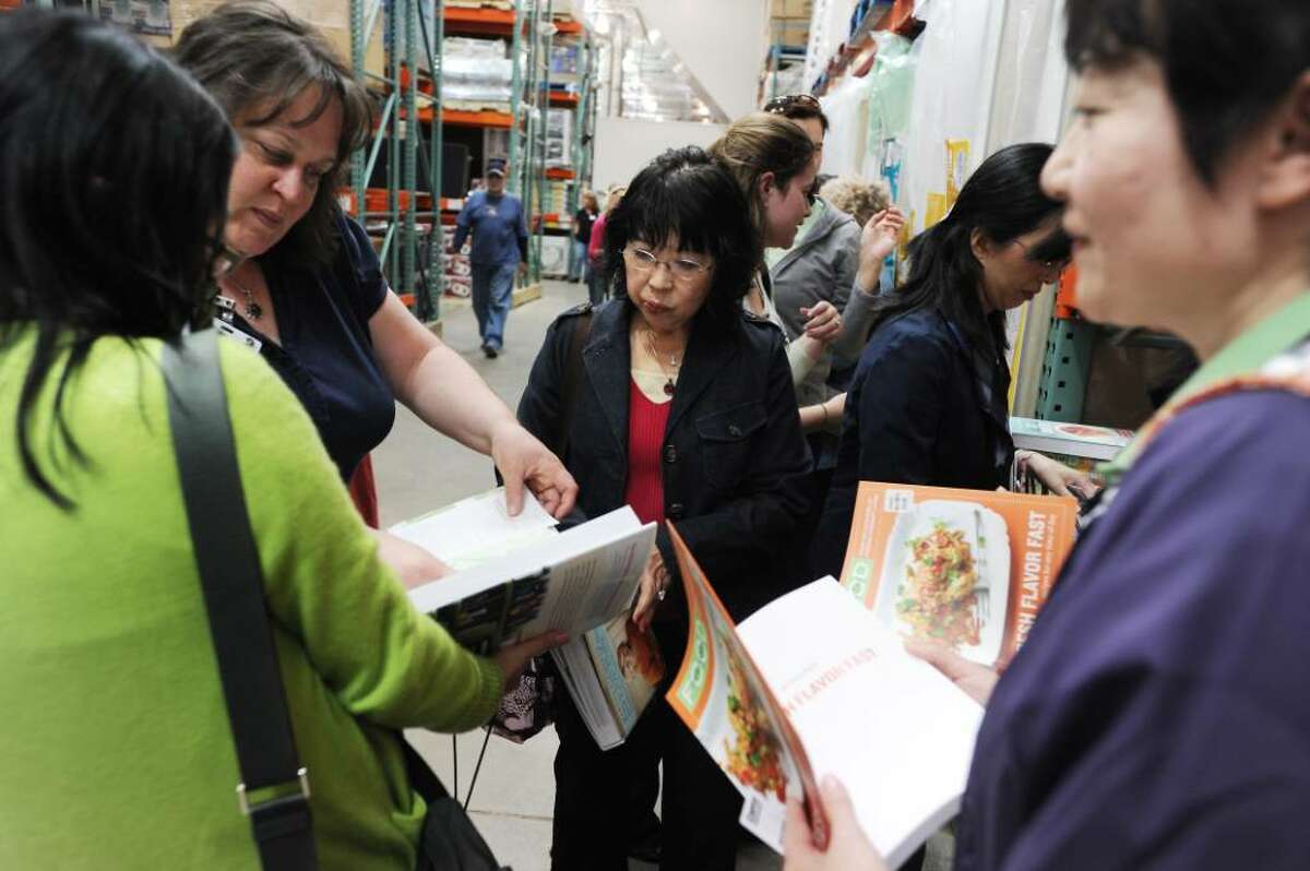 A group of women wait in line as Martha Stewart signs copies of her new book, "Martha Stewart's Encyclopedia of Sewing and Fabric Crafts" and bestsellers "Martha Stewart's Encyclopedia of Crafts" and "Everyday Food: Fresh Flavor East" at Costco in Norwalk, Conn. on Thursday April 29, 2010.