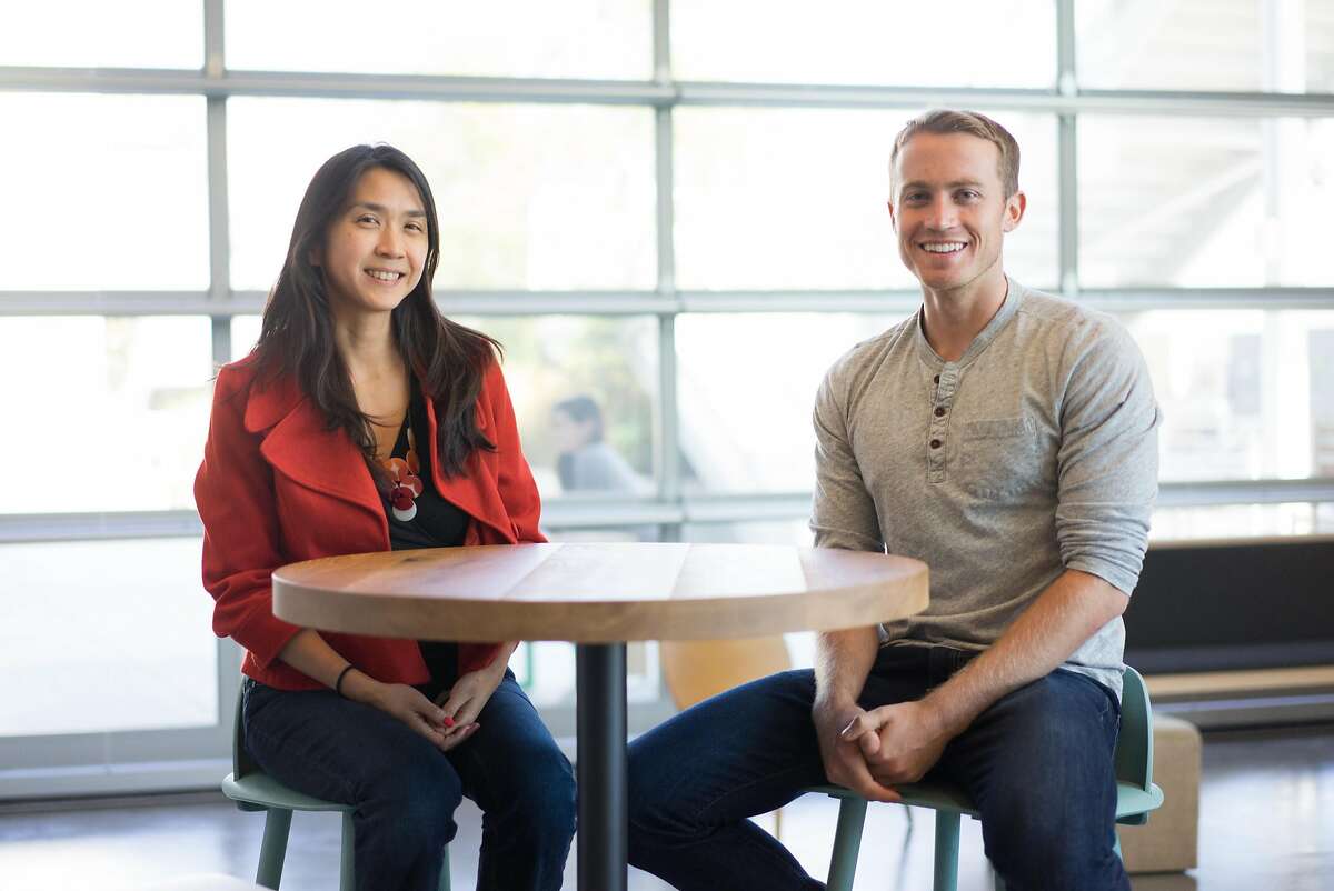 Katherine Woo, left, and Peter Cottle pose for a photograph at Facebook Headquarters in Menlo Park, Calif. on Wednesday, Aug. 17, 2016. Facebook's Safety Check allows users to mark if they are unharmed in the event of a natural disaster or terrorist attack.