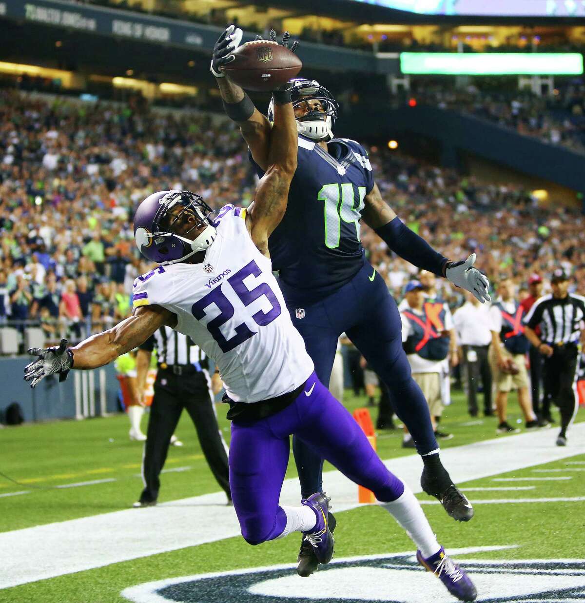 Seattle Seahawks quarterback Trevone Boykin (2) dives to score a two-point  conversion over Minnesota Vikings safety Jayron Kearse, right, in the  second half of a preseason NFL football game, Thursday, Aug. 18