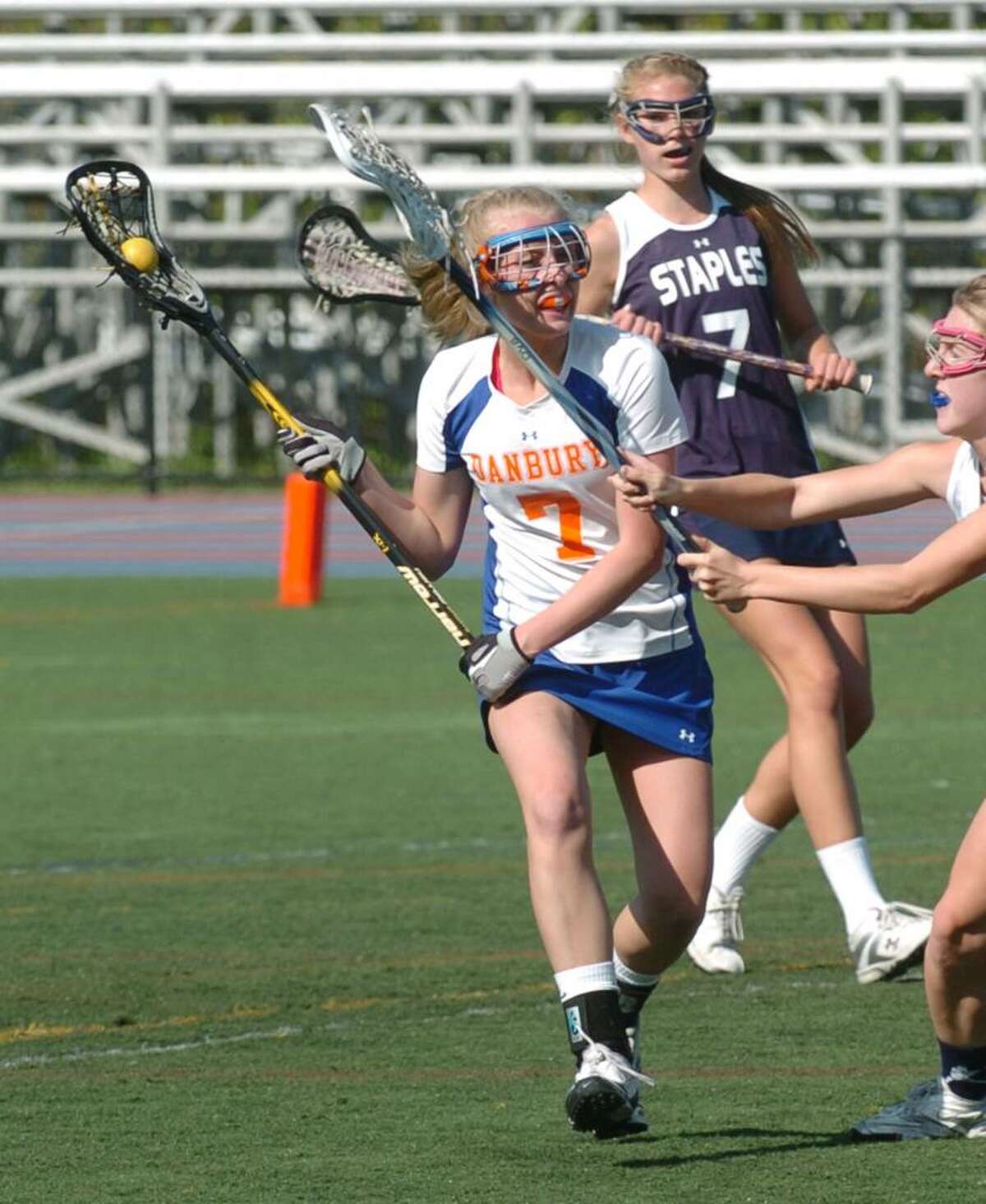 Danbury's, 7, Kate Keckeisen heads up-field during the girls lacrosse game against Staples at Danbury High, Friday, April 30, 2010.
