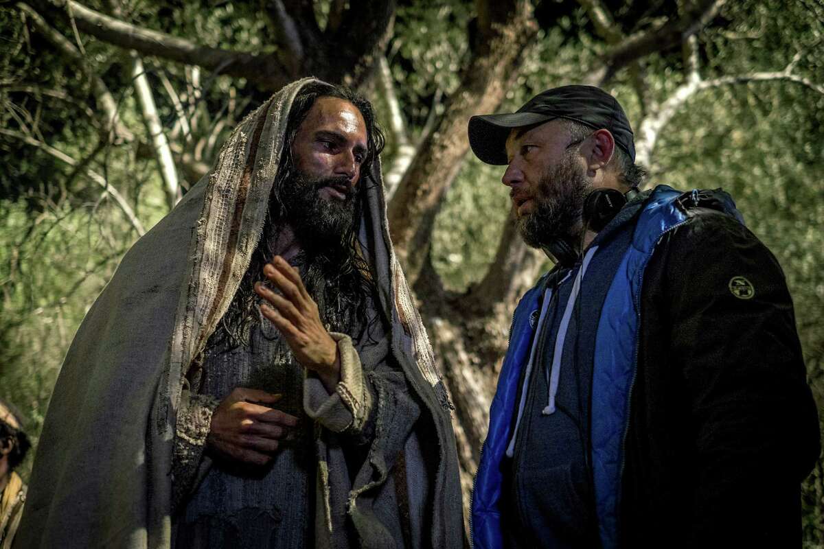 This image released by Paramount Pictures shows Rodrigo Santoro who portrays Jesus, left, and director Timur Bekmambetov on the set of "Ben-Hur." (Philippe Antonello/Paramount Pictures via AP)