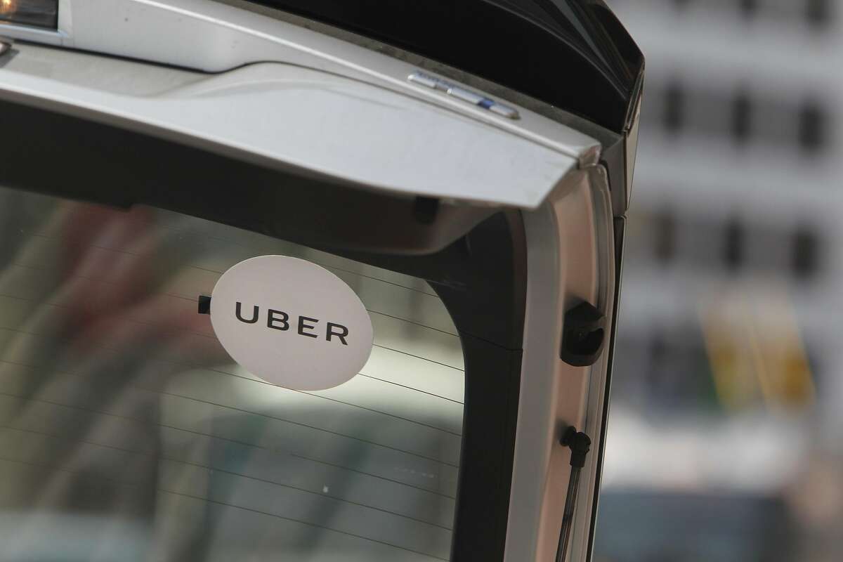 A sign for Uber is seen on a vehicle on Friday, August 19, 2016 in San Francisco, California.