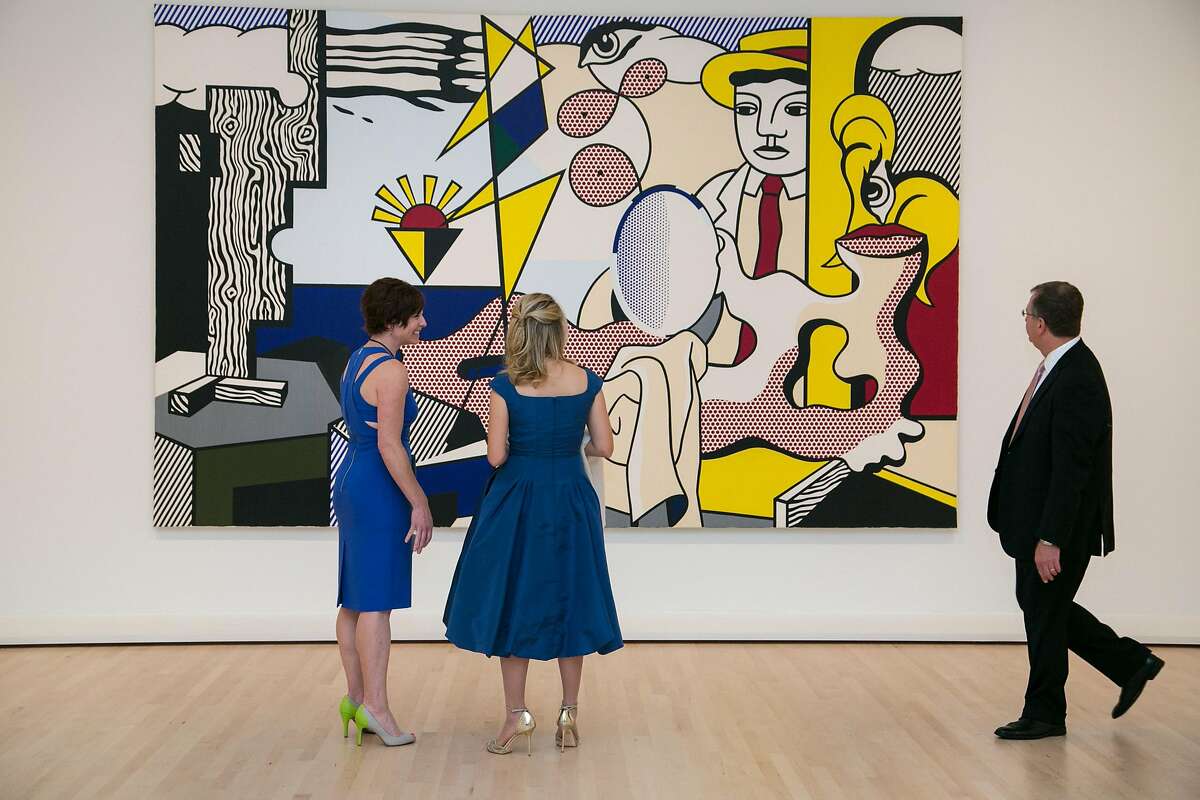 From left: Nancy Finn, Danna Slusky and her husband Alex Slusky check out "Figures with Sunset," a 1978 painting by Roy Lichtenstein, during The Modern Ball 2016 at SFMOMA on Thursday, May 12, 2016 in San Francisco, Calif.