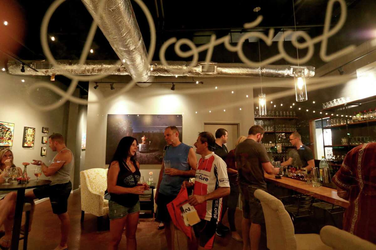 Customers enjoy a drink at Dorcol Distilling + Brewing Co.