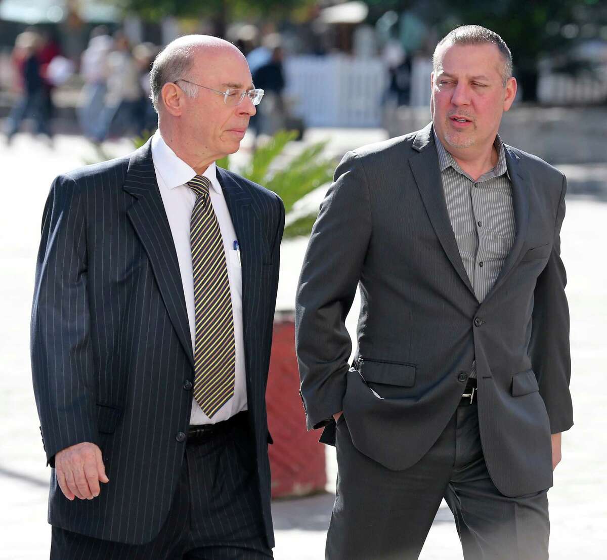 Attorney Martin Seidler (left) and Stan Bates walk into the Hipolito F. Garcia Federal Building to attend a bankruptcy court hearing. Bates, who was majority owner of San Antonio frac sand company FourWinds Logistics, has been accused of using investor money to support a “wild lifestyle,” according to a court document. Bates has disputed the allegation.