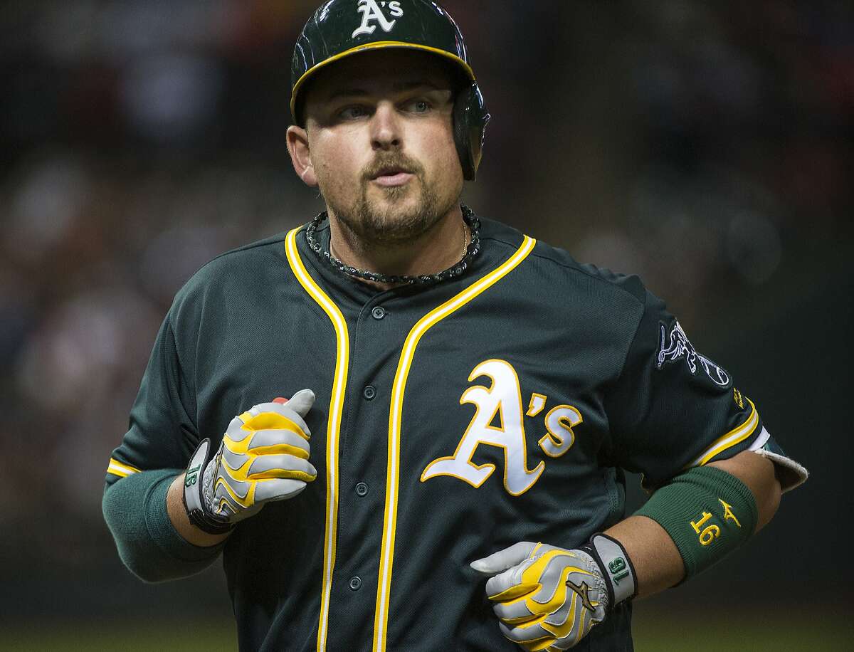 Oakland Athletics' Billy Butler heads back to the dugout after flying out against the Cleveland Indians during the ninth inning of a baseball game in Cleveland, Saturday, July 30, 2016. (AP Photo/Phil Long)
