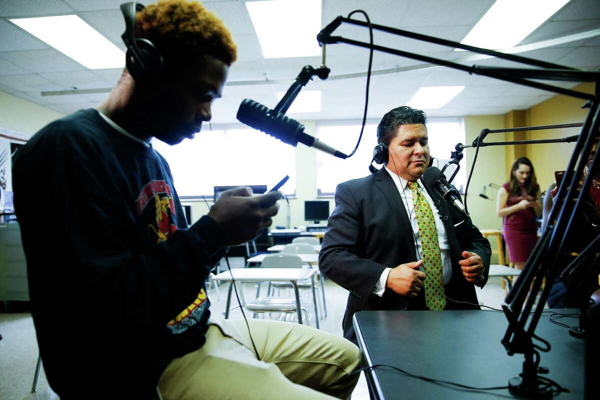 Superintendent Richard Carranza prepares to be interviewed Monday on the Yates High School radio station by sophomore Kenneth Lee.