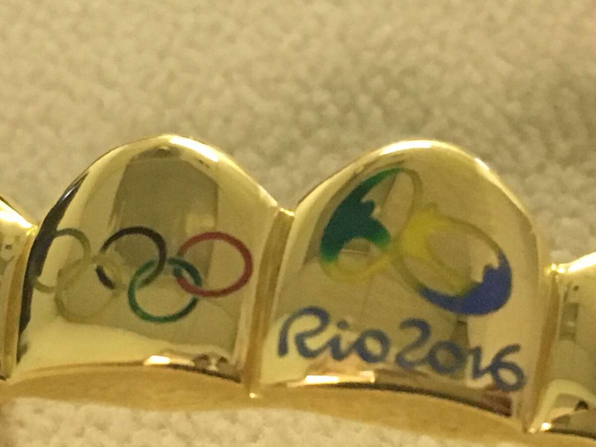 Rapper Paul Wall offers Olympians free gold grillz