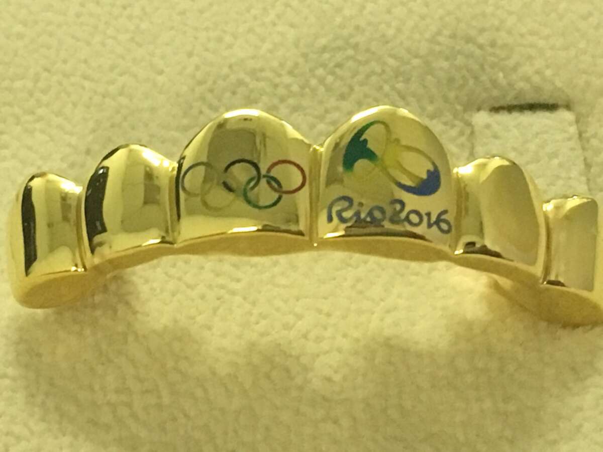 Rapper Paul Wall offers Olympians free gold grillz