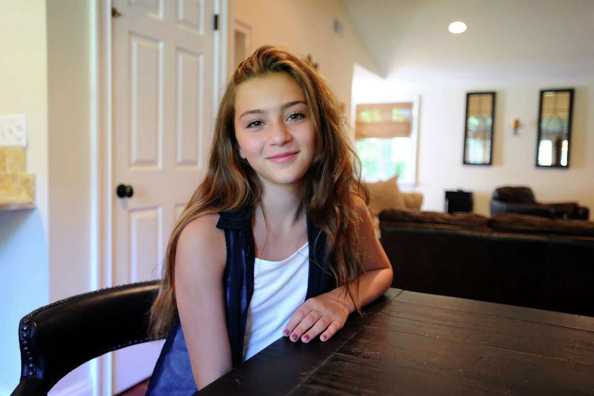 12-year-old Lucy Scorziello, a rising 7th grader at Rippowam Middle School, poses for a photo inside her Stamford, Conn. home on Monday, August 22, 2016. Scorziello was recently chosen to sing America the Beautiful at the U.S. Open on Aug. 30.